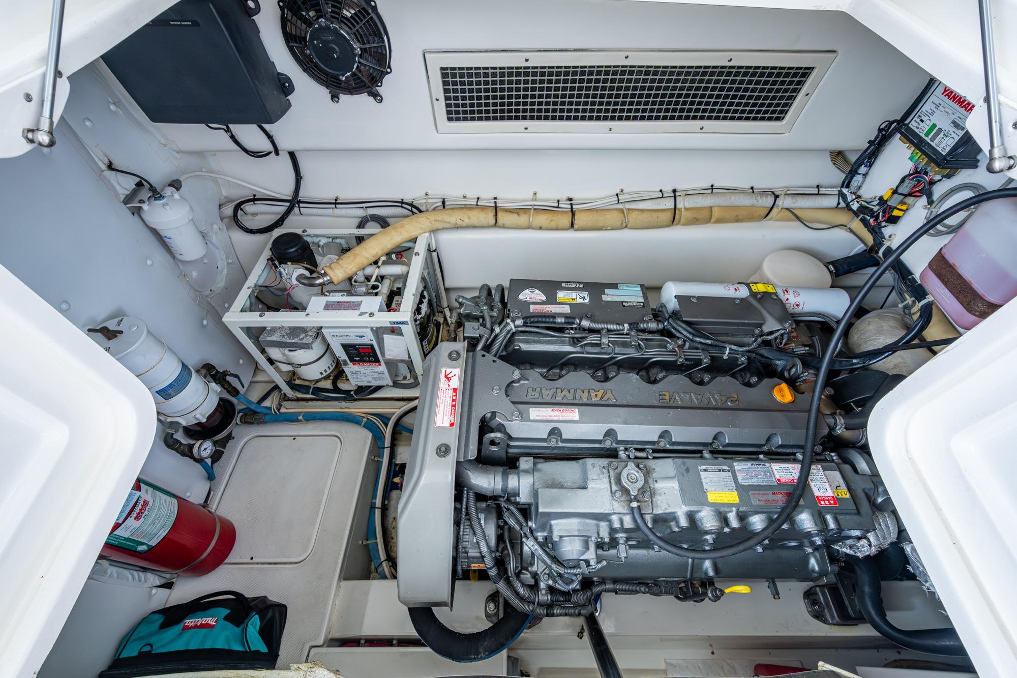 Engine room of 2008 Ocean Yachts 37 Billfish with Yanmar engine and equipment.