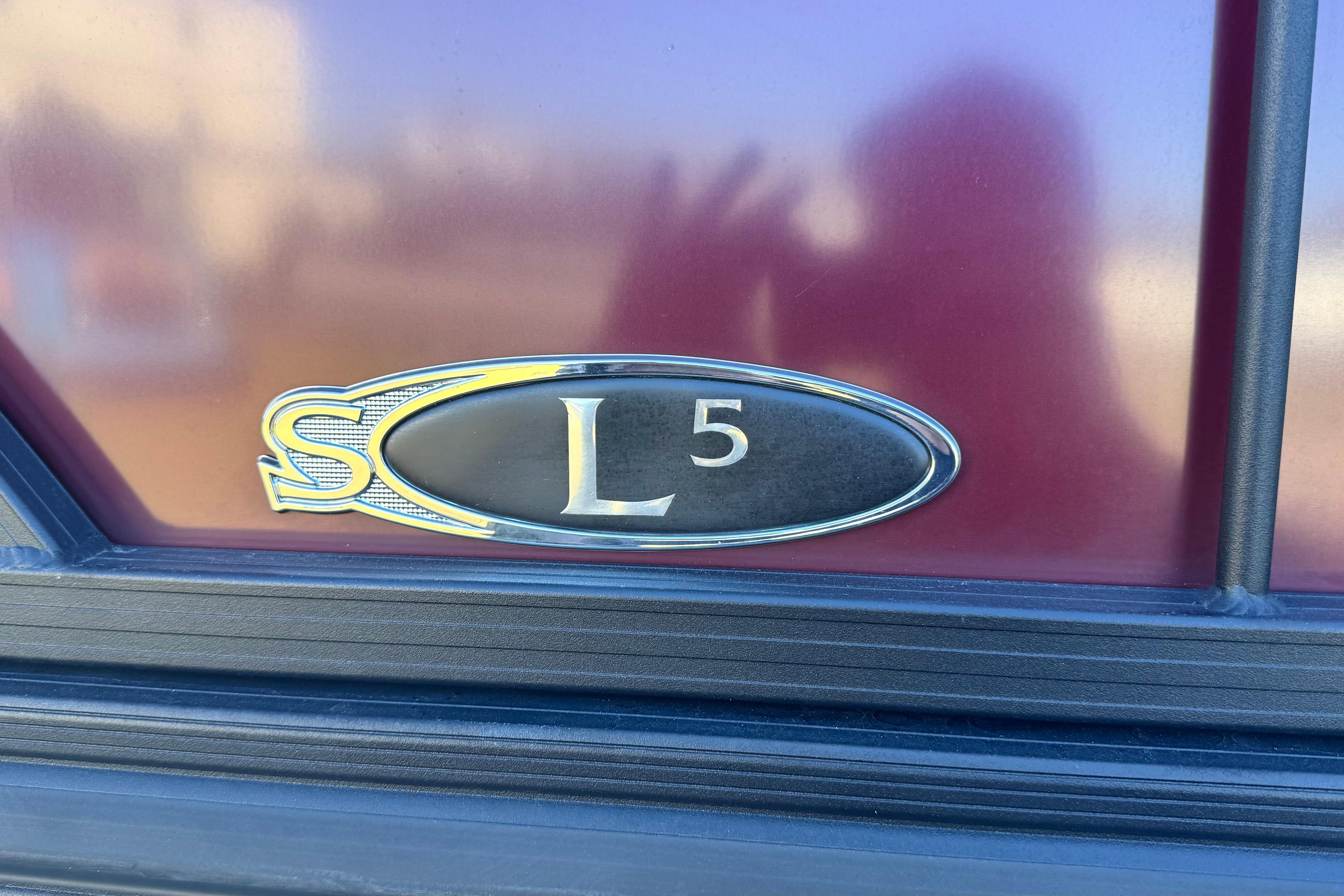 2023 Sylvan L5 CLZ emblem on a maroon background.