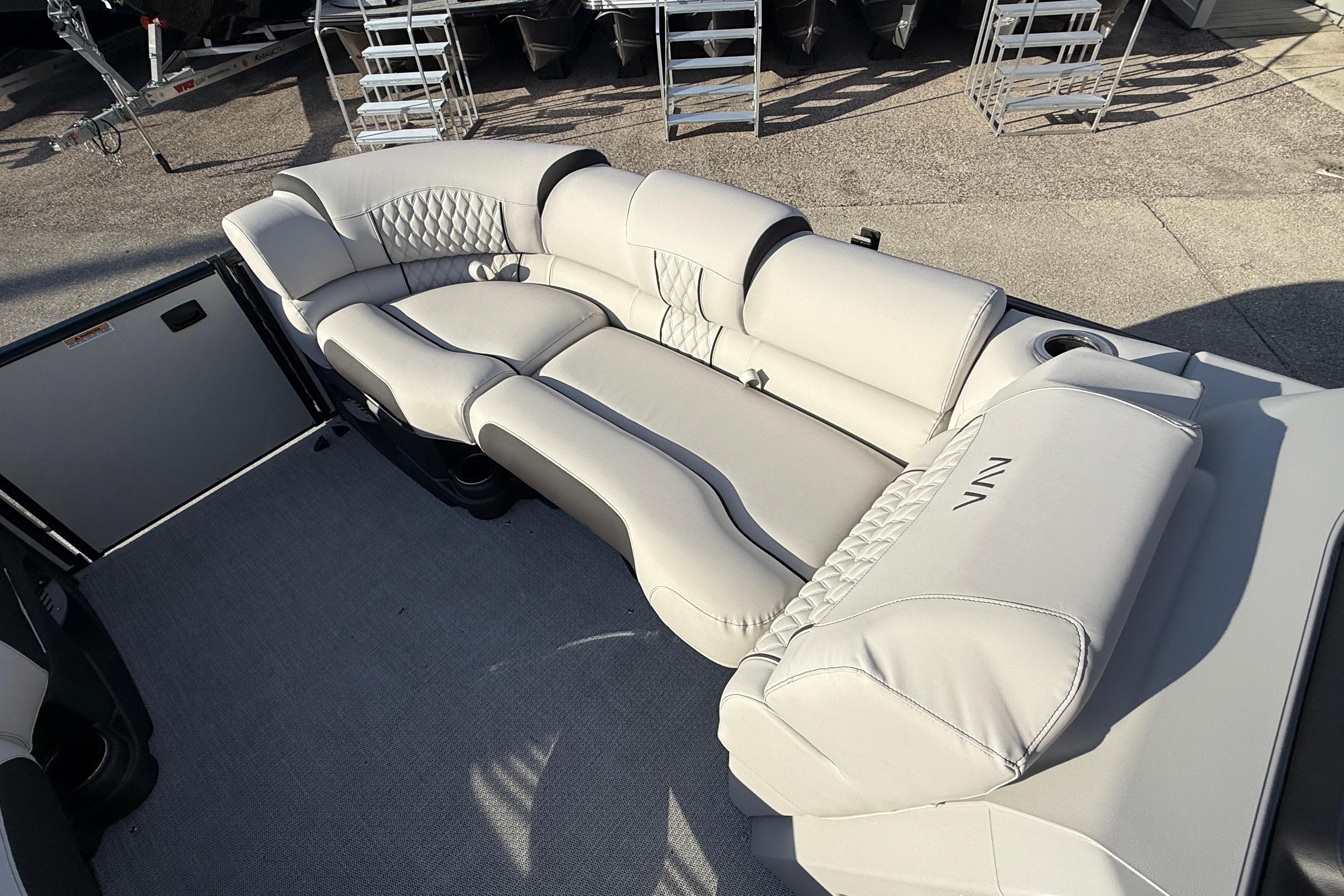 Luxurious seating on 2026 Avalon 2385 Catalina Quad Lounger, Tri Toon High Performance boat.