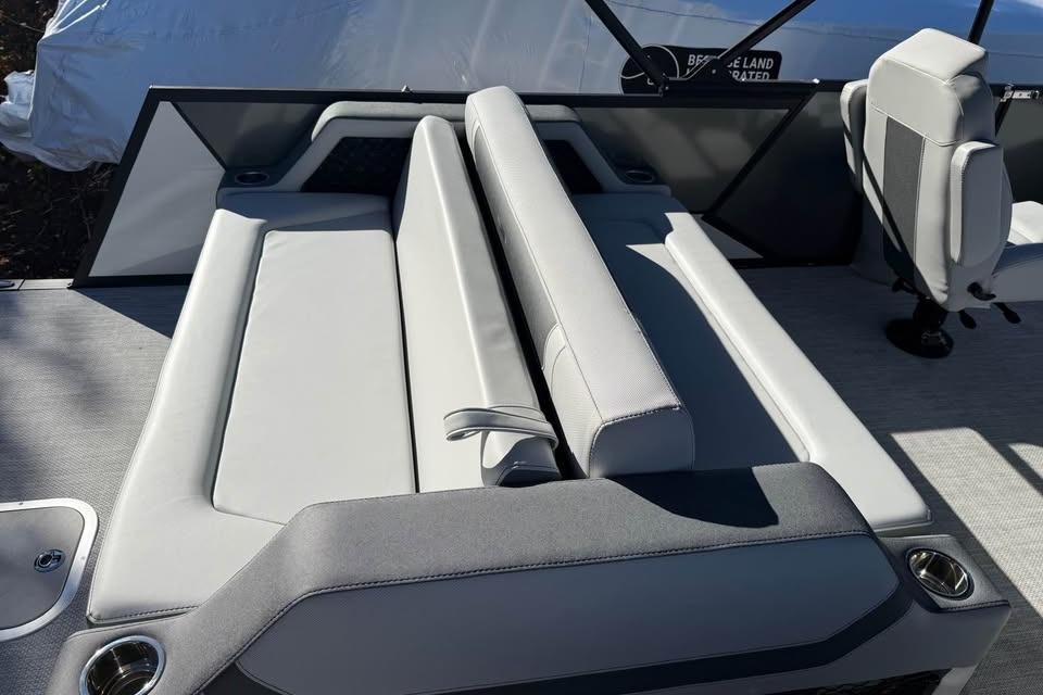 2026 Alera M 23L boat interior with gray seating and cup holders.