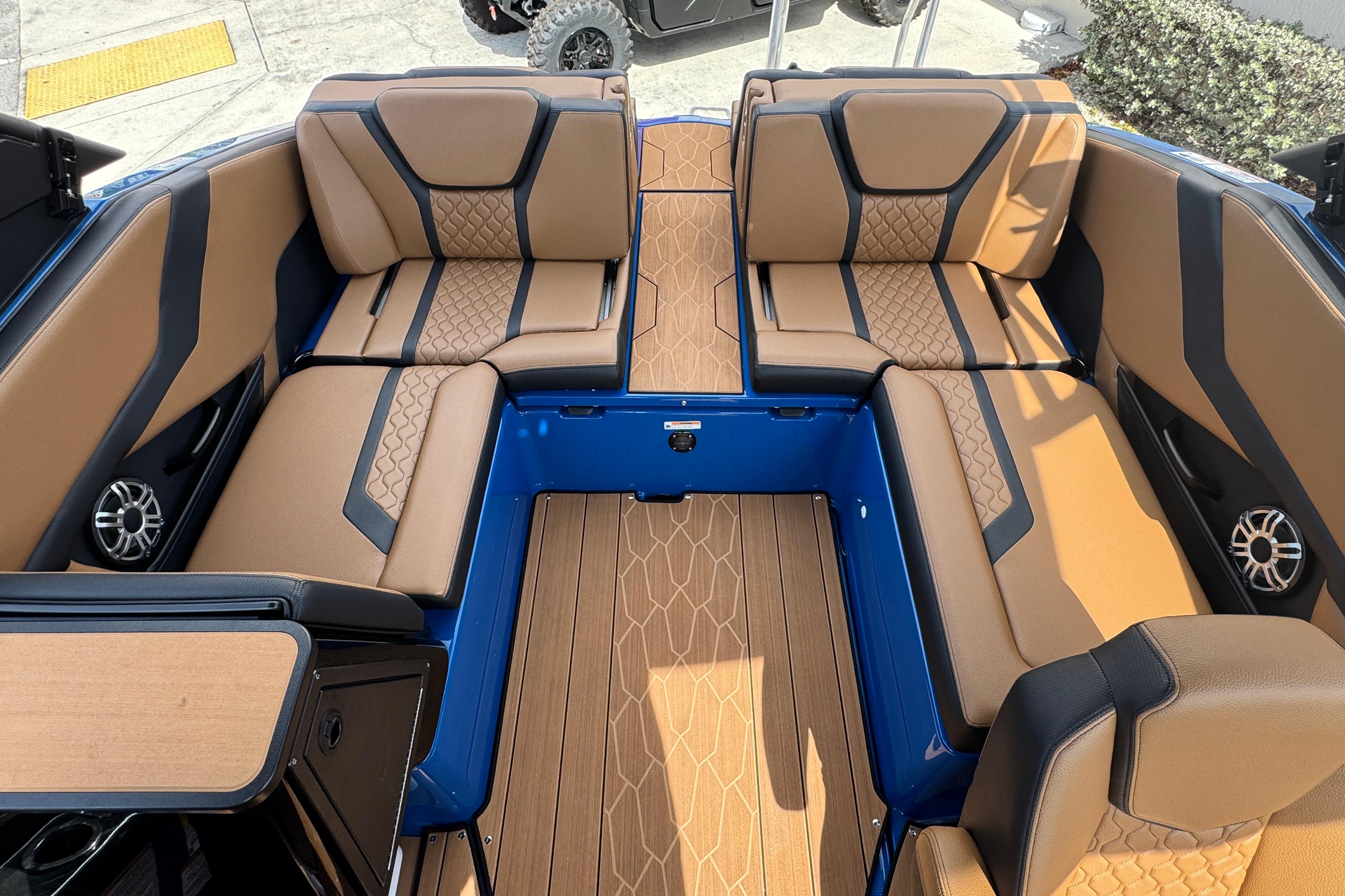 2026 Yamaha Boats 255XD interior with tan seating and modern design.