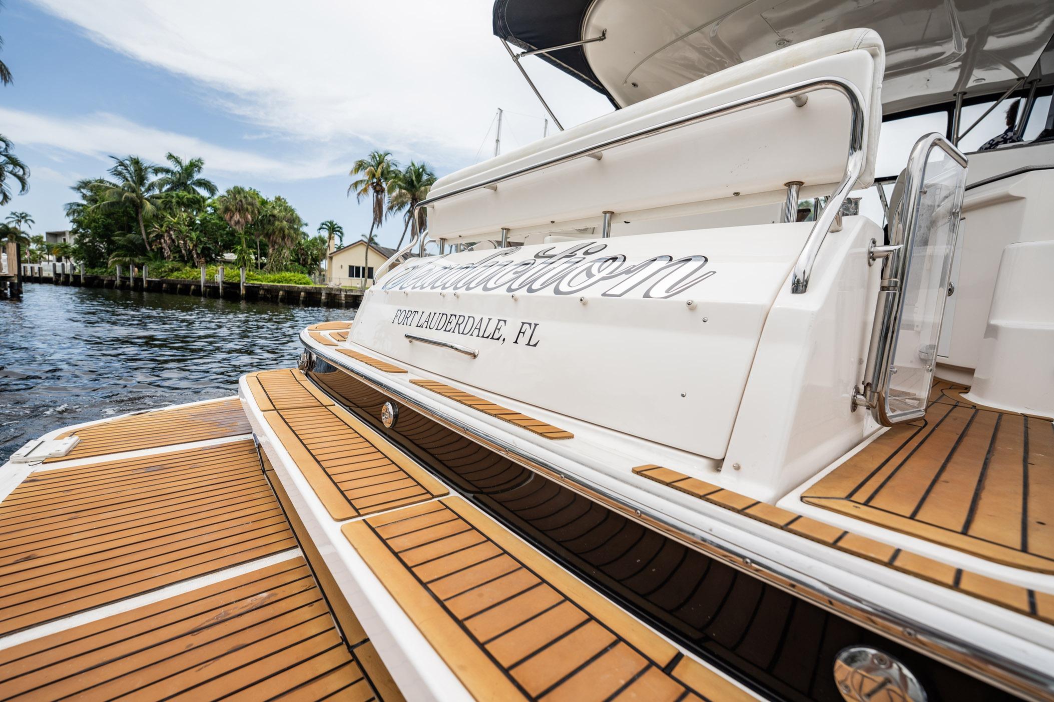 2008 Regal Commodore 4460 yacht docked in Fort Lauderdale, featuring teak decking.