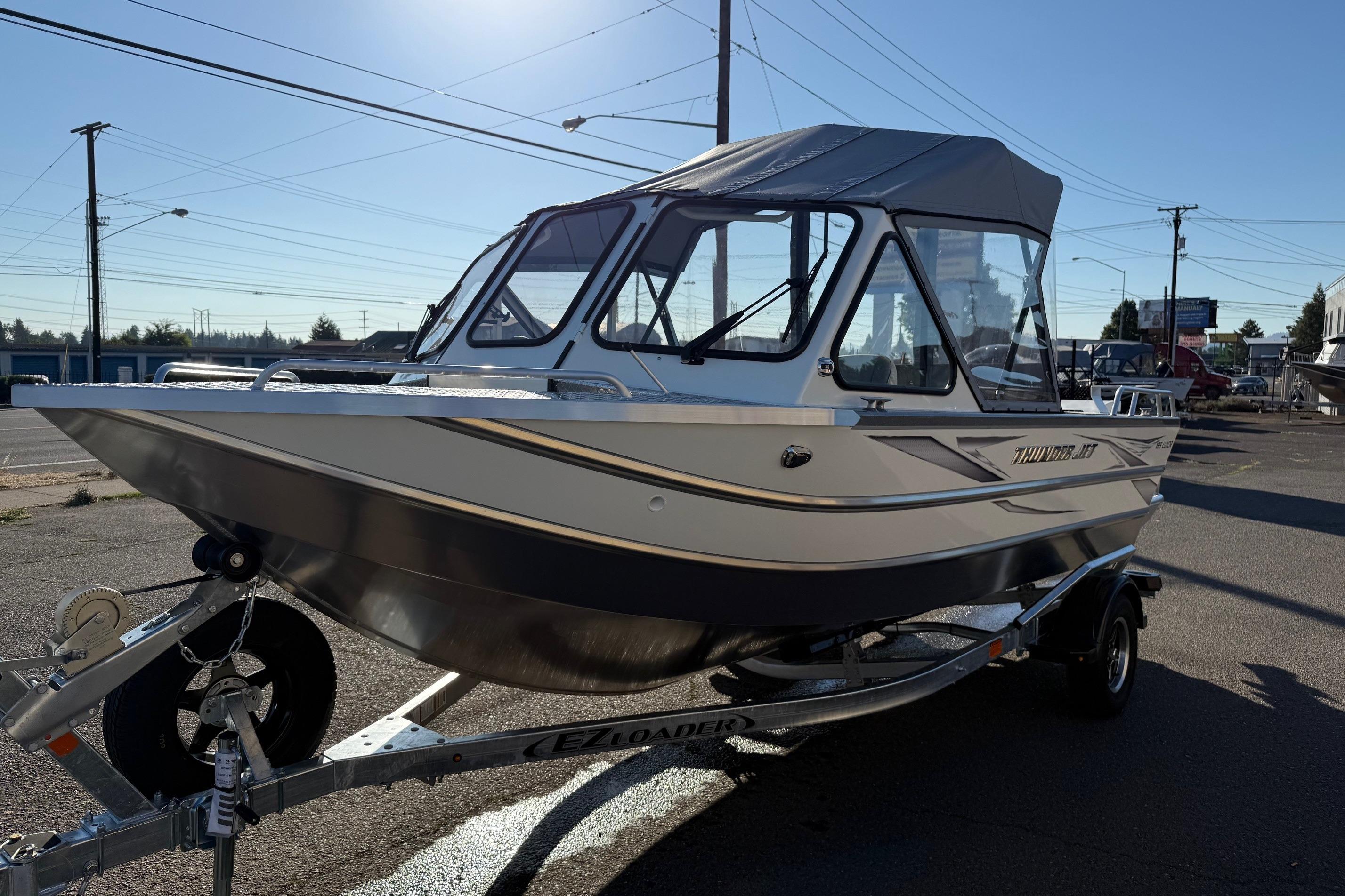2026 Thunder Jet 185 Luxor boat on trailer, parked outdoors under clear sky.