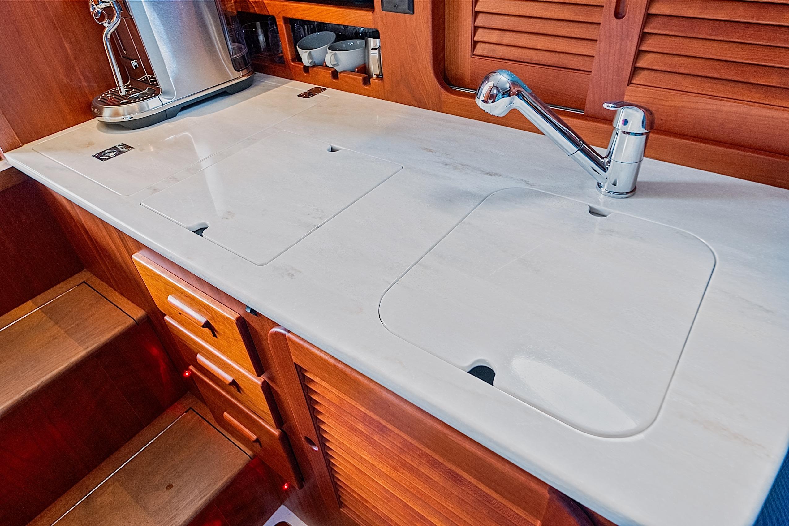 Hinckley Picnic Boat 37 MKIII 2018 galley with sleek countertop and modern faucet design.