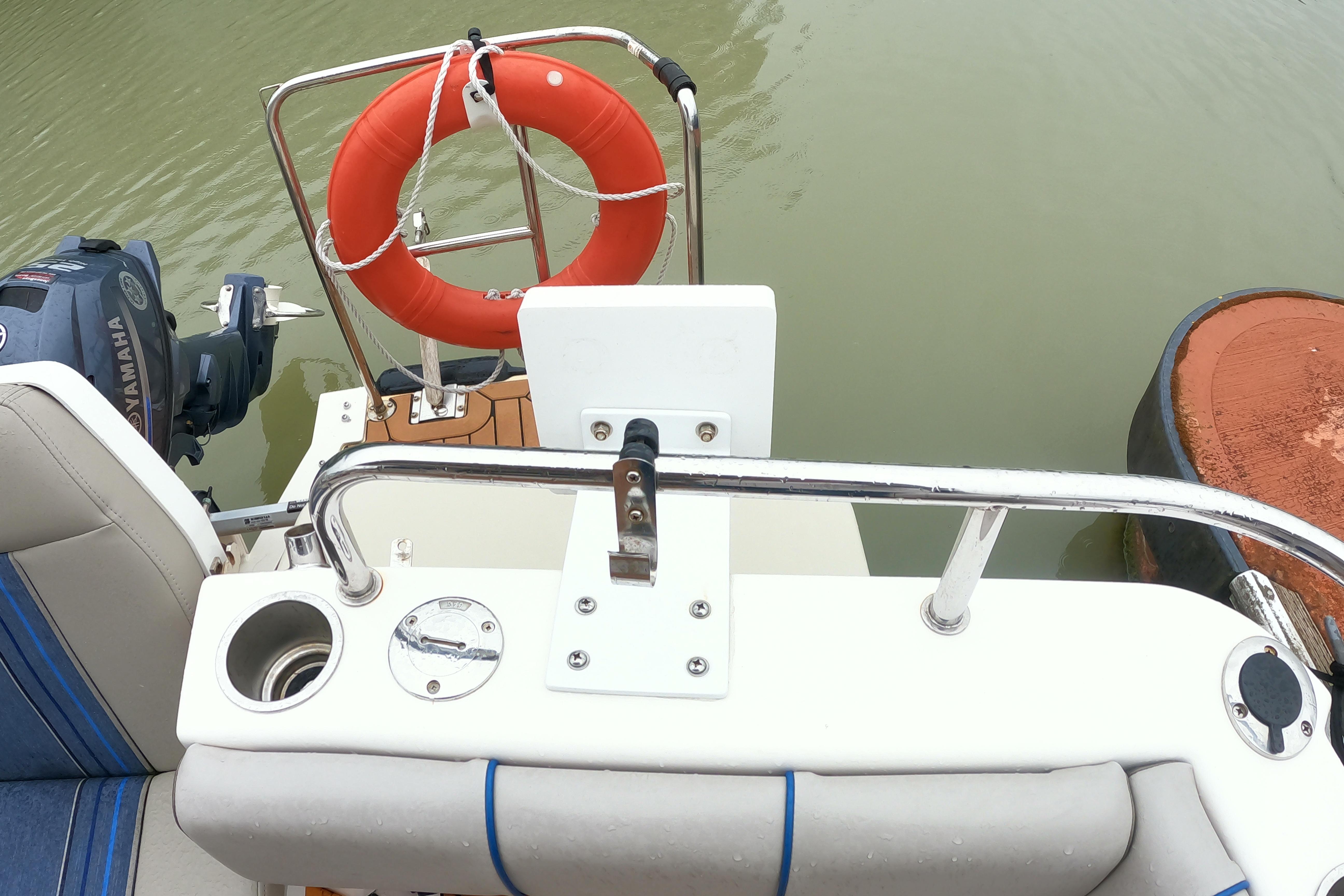 2019 Cutwater C-30 Sedan boat stern with Yamaha motor and safety equipment.