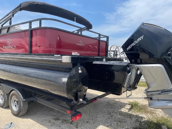 2023 Regency 250 DL3 pontoon boat with Mercury engine on trailer.