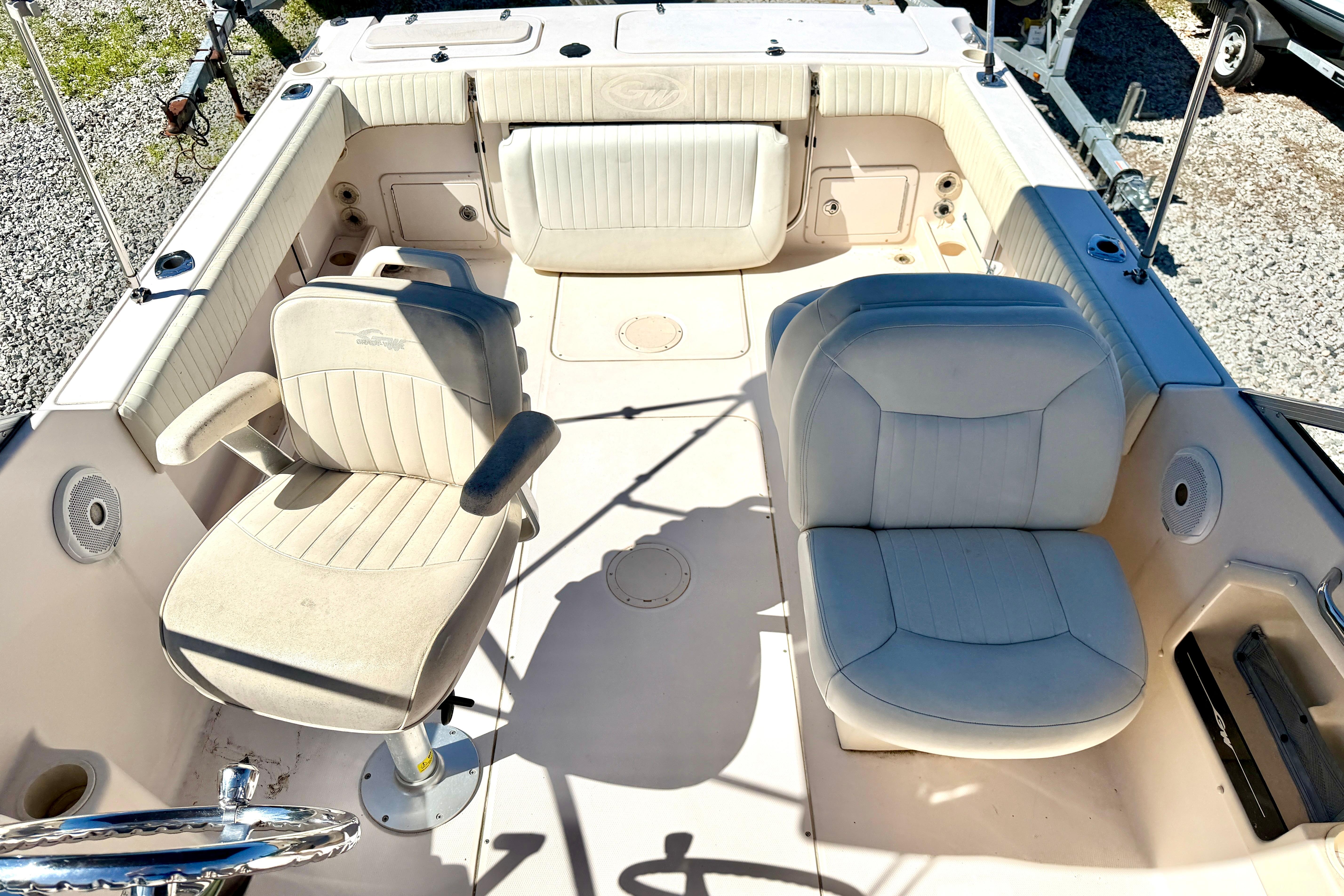 2005 Grady-White Freedom 225 boat interior with seating and steering wheel.