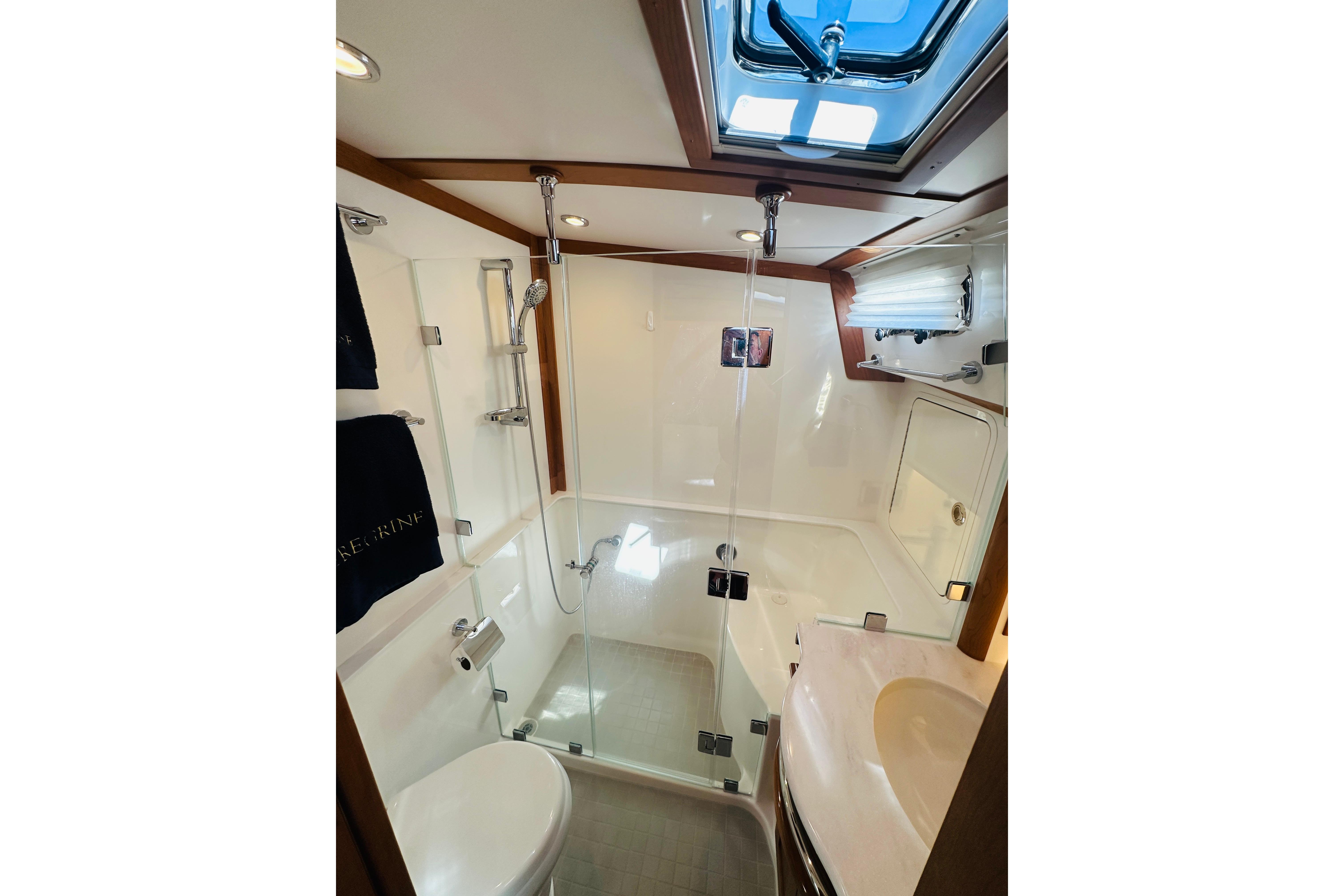 Modern bathroom interior of 2025 Sabre 48 Salon Express yacht, featuring sleek design and glass shower.