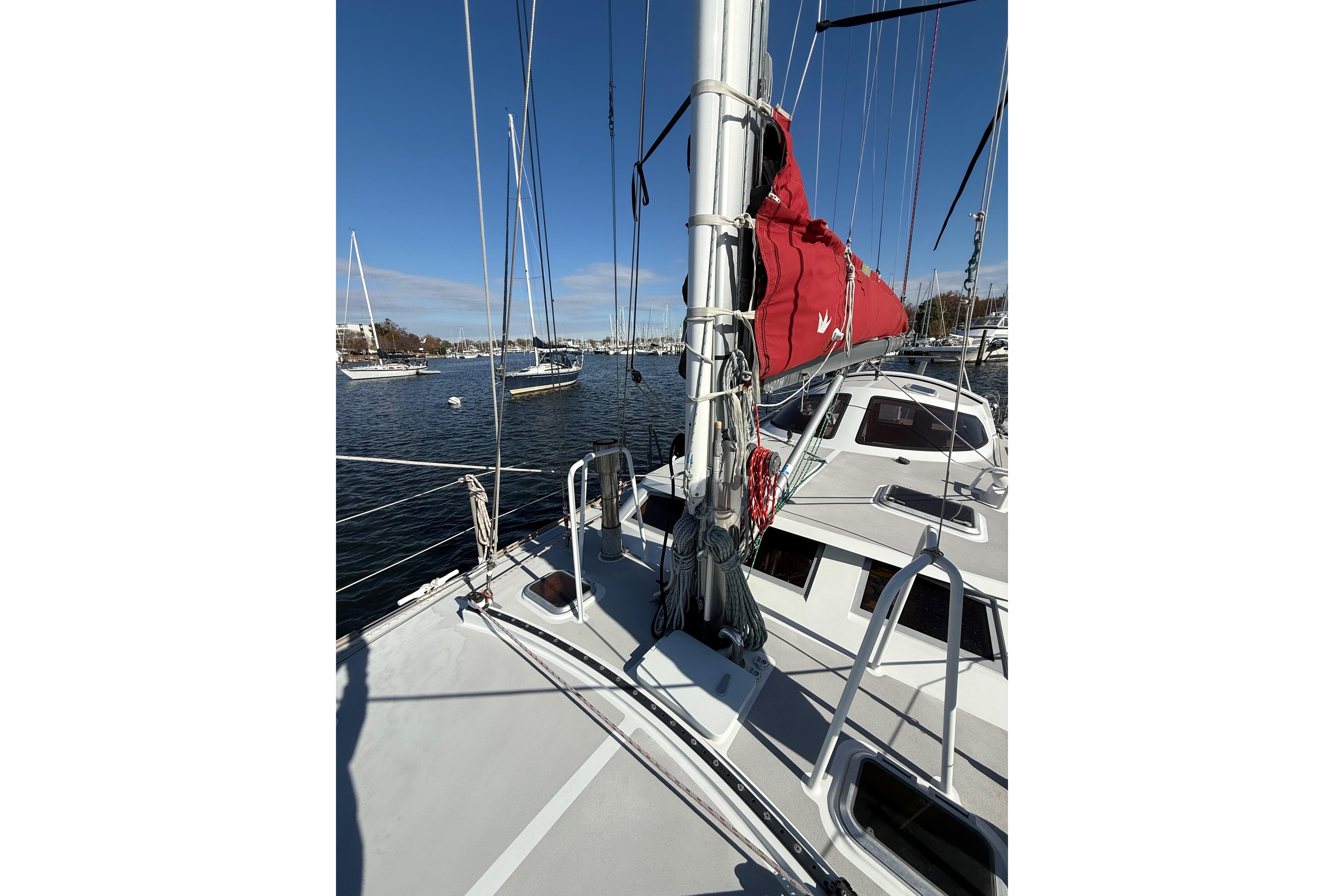 Sailboat Boreal 47, 2017 model, docked with red sail cover, clear sky.