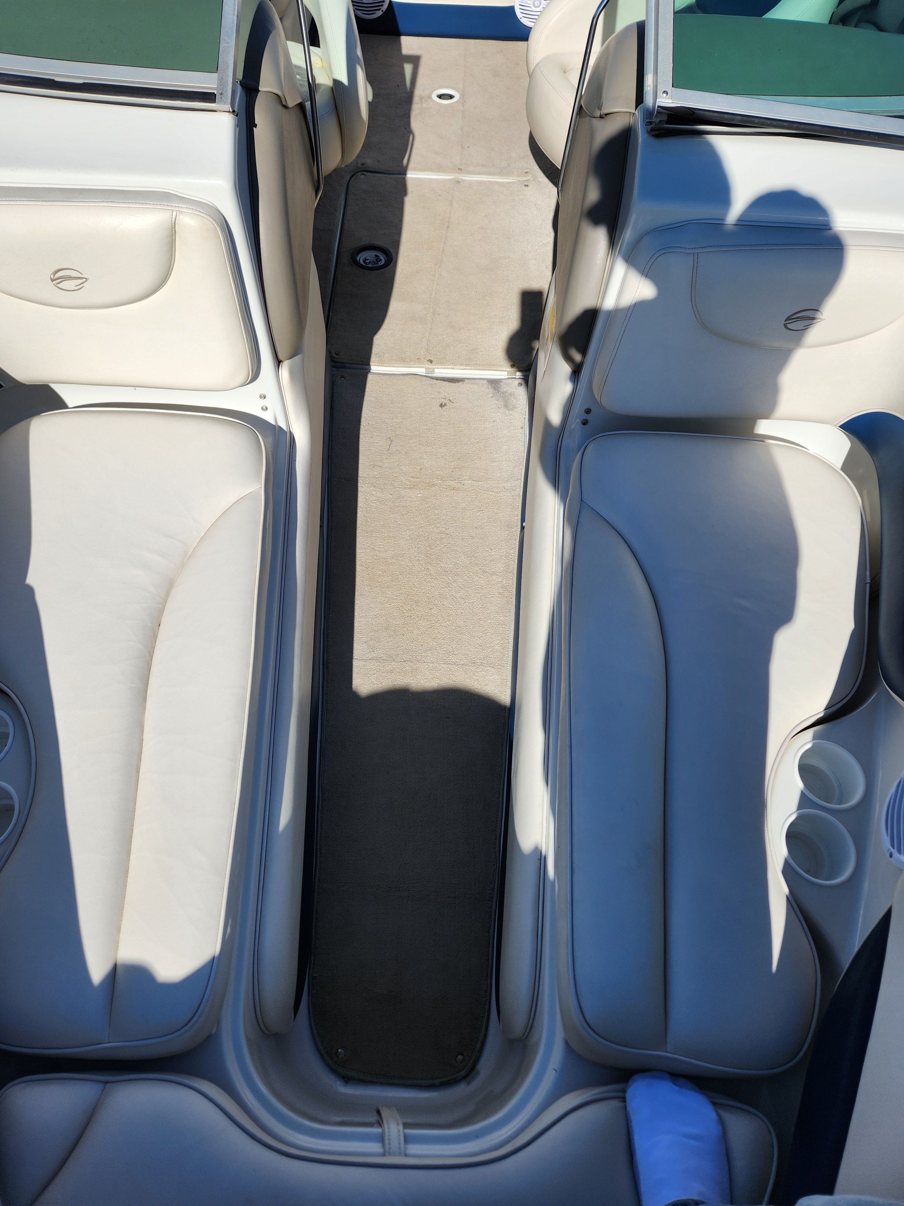Interior of a 2003 Crownline 225 BR boat with beige seating.