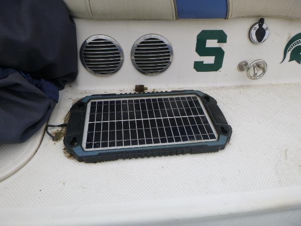 Solar panel on a 2007 Bayliner 197 Deck Boat with ventilation grilles and seat.