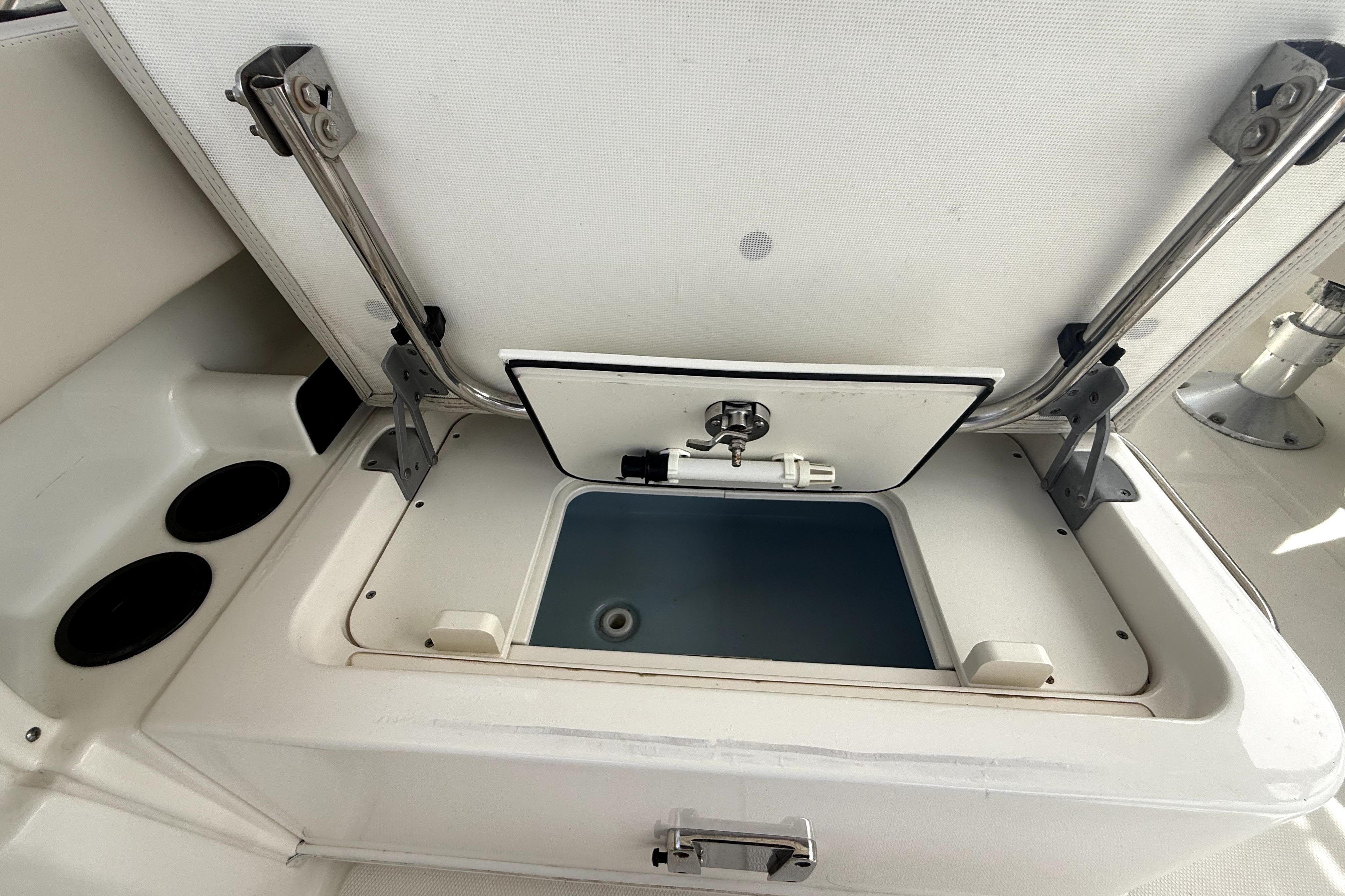 Open storage compartment on a 2018 Boston Whaler 230 Vantage boat.