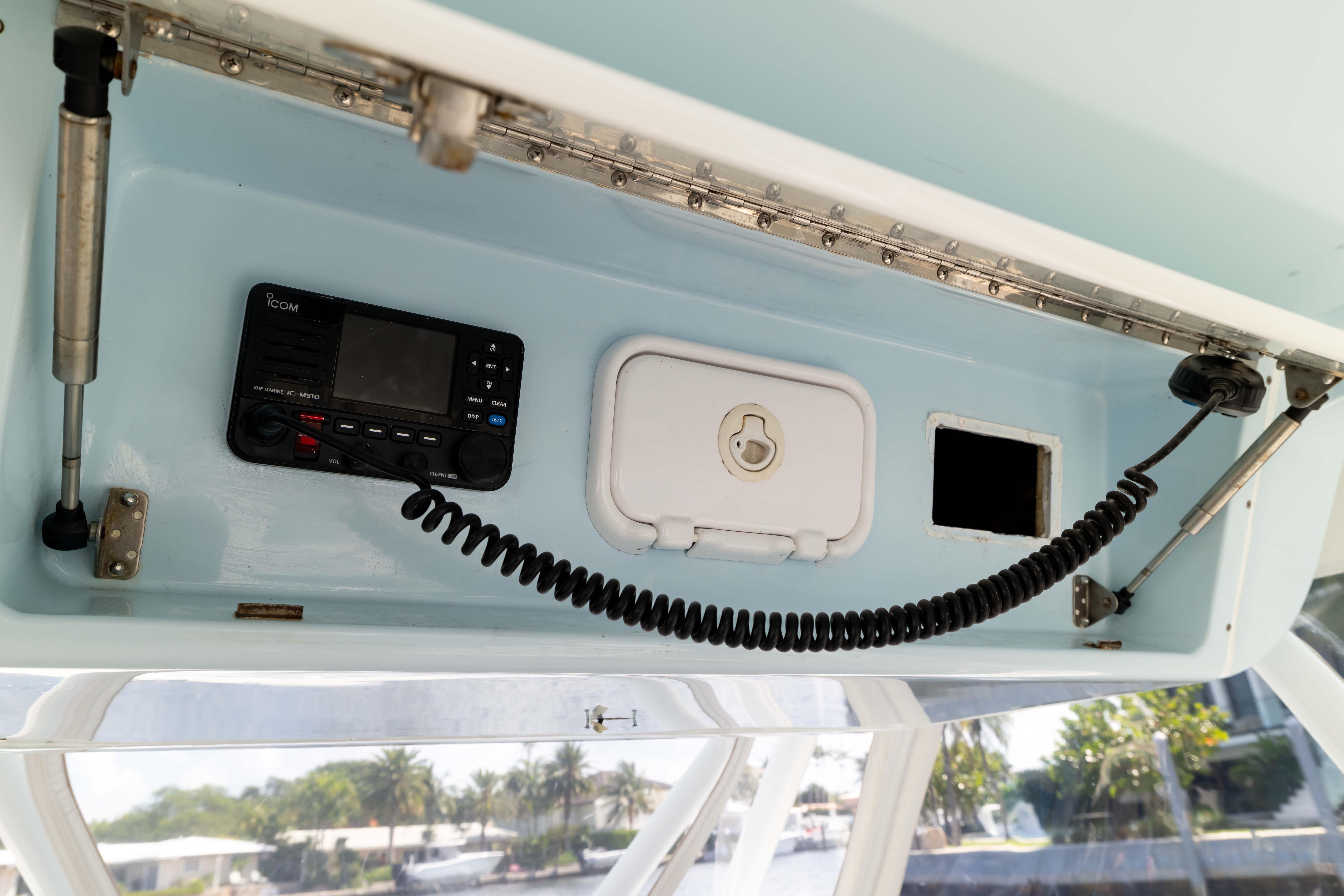 2011 Yellowfin 42 Offshore boat console with radio and storage compartments.