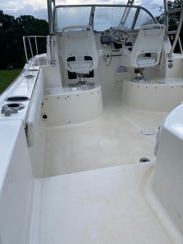 2008 Sea Fox 236WA Pro Series boat interior with dual captain chairs and steering console.