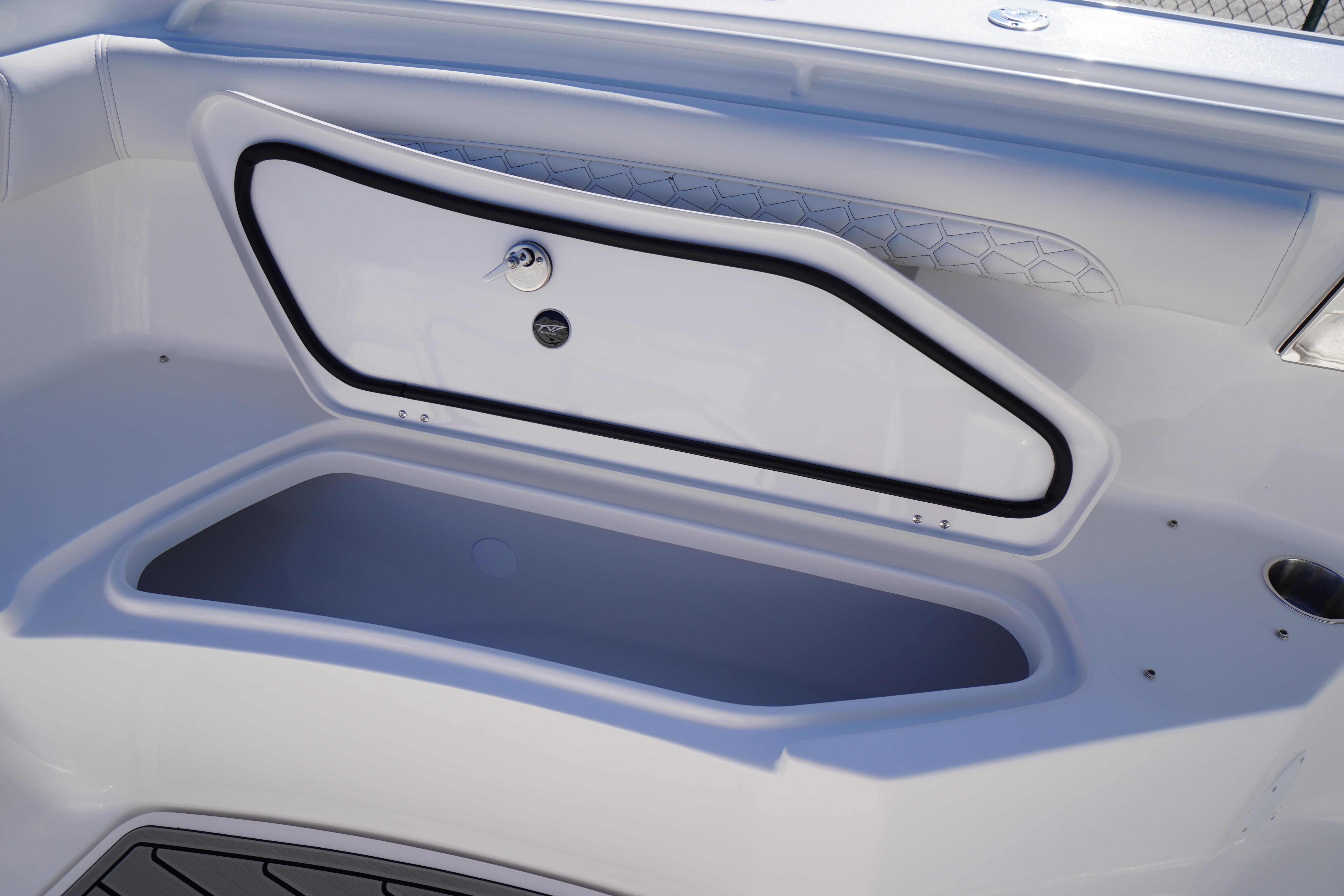 2026 Tidewater 272 LXF boat storage compartment with secure latch and sleek design.