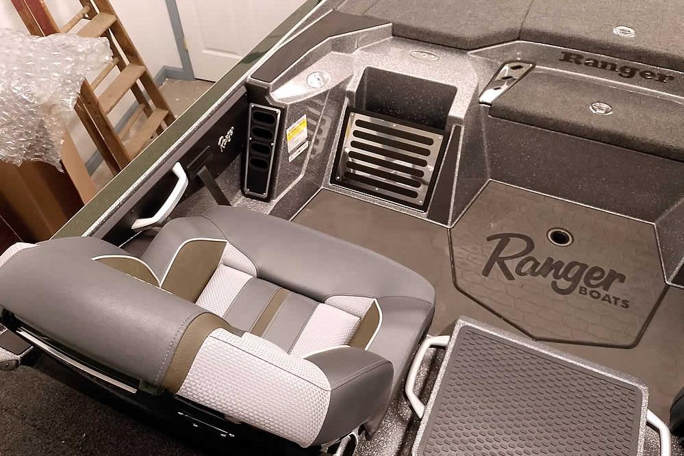 2026 Ranger Z519R Cup-Equipped boat interior with branded seating and storage compartments.