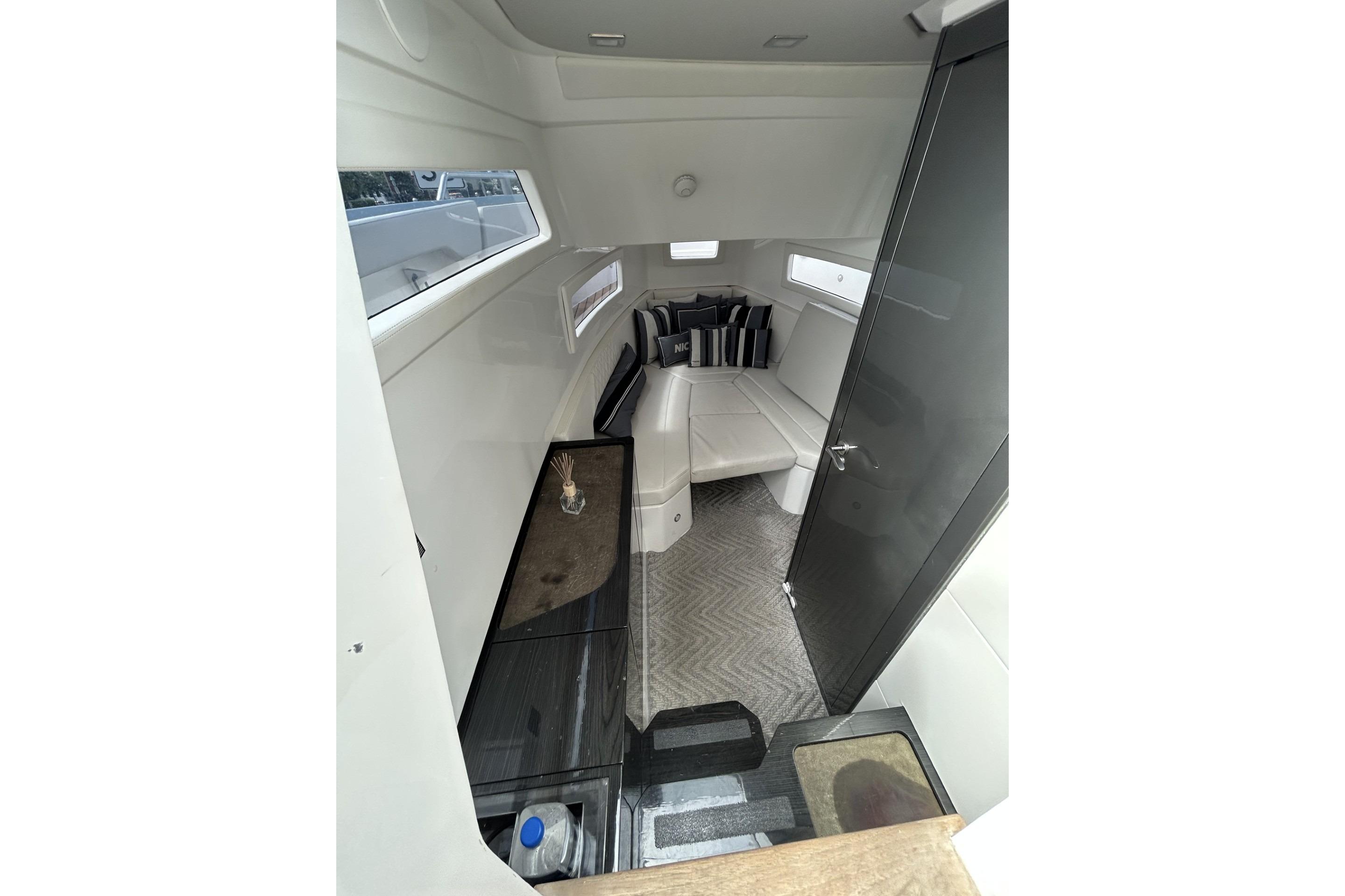 Interior of 2023 Schaefer V33 yacht, featuring modern seating and sleek design elements.