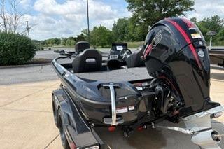 2026 Nitro Z18 boat with powerful outboard motor, parked outdoors on a sunny day.