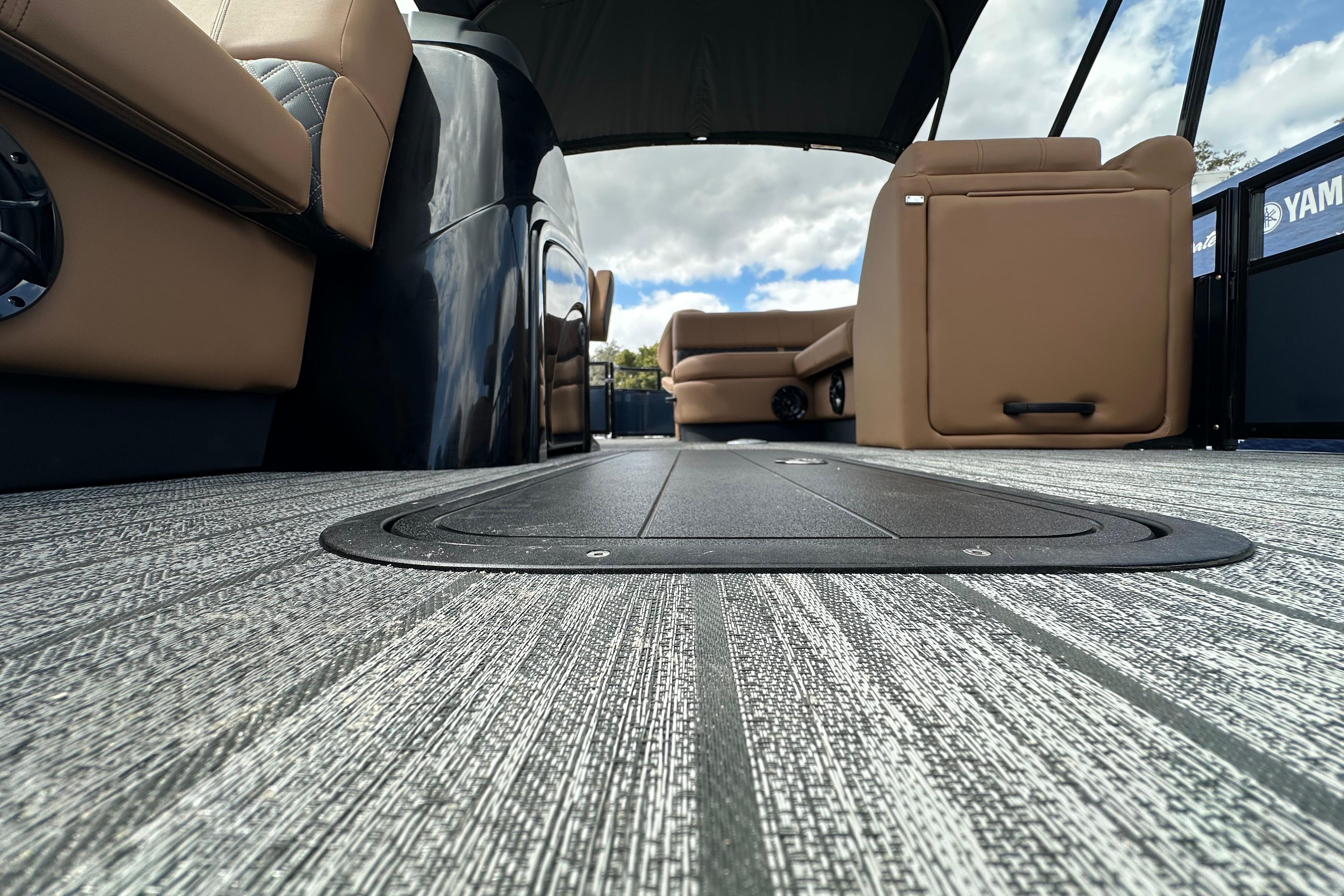 2026 Ranger Reata 223FC boat interior with modern seating and textured flooring.