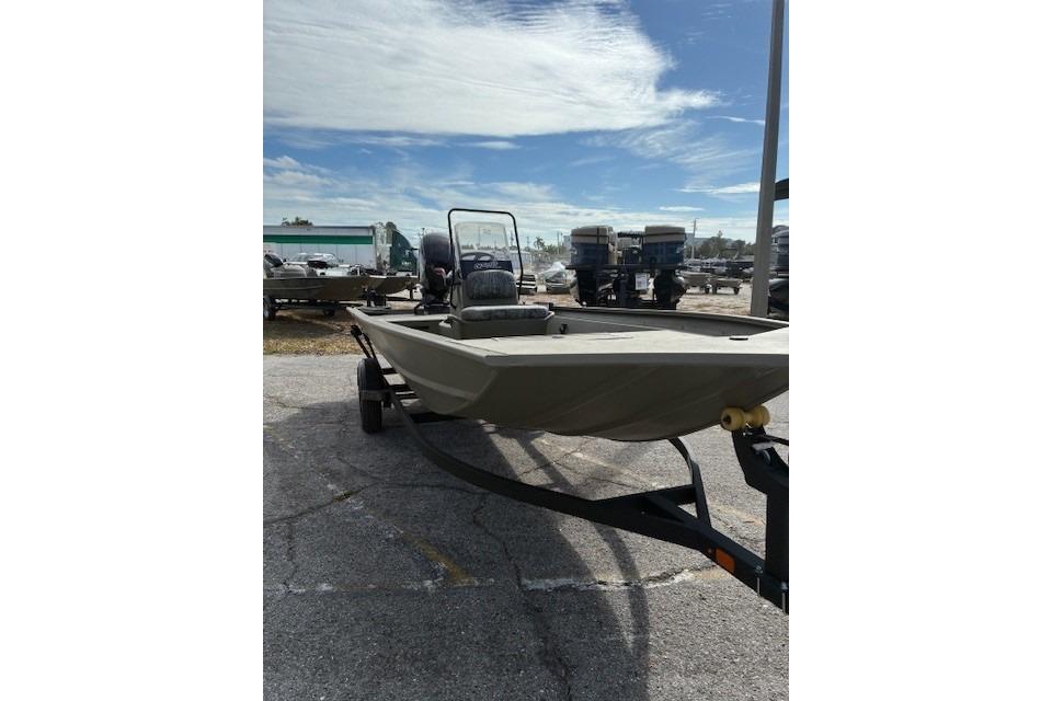 2026 Tracker Grizzly 1860 CC boat on trailer under a partly cloudy sky.