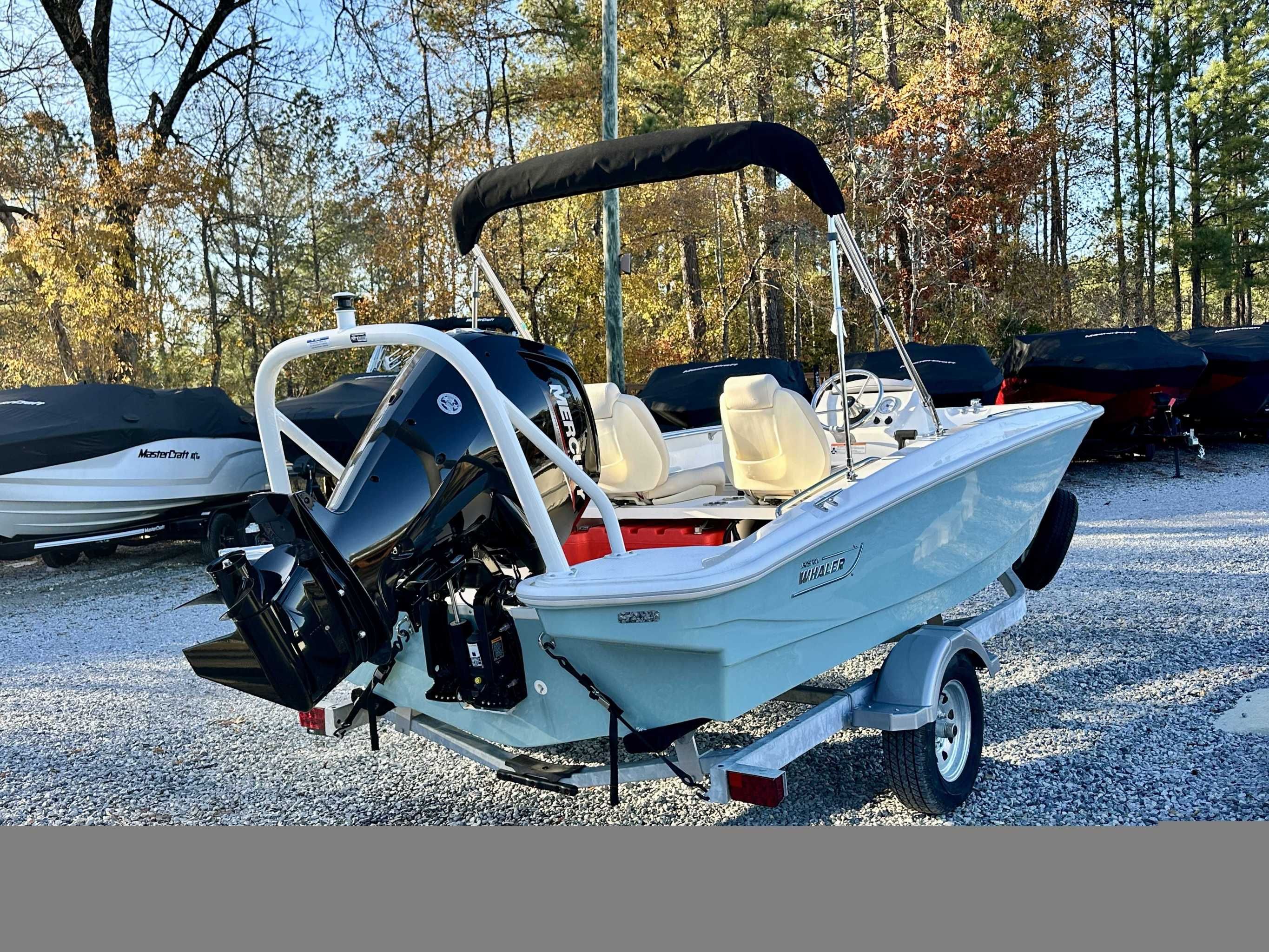 2025 Boston Whaler 160 Super Sport boat on trailer outdoors.