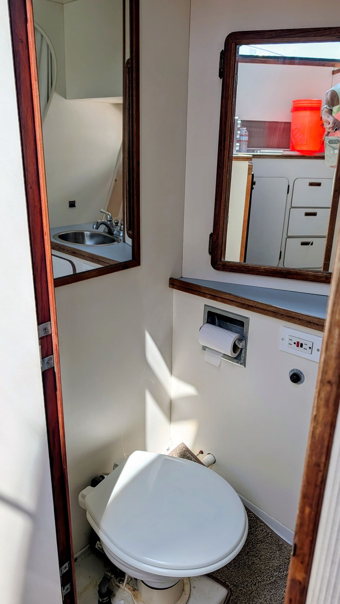 The image shows the bathroom of a 1987 Chris-Craft 320 Amerosport Express with a toilet and sink.