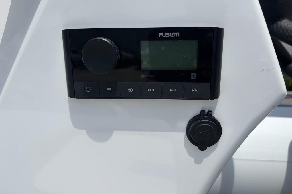 Control panel on 2026 Highfield Classic 360 boat, featuring Fusion audio system.