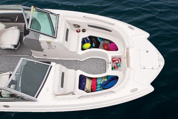 Manufacturer Provided Image: 2016 Chaparral 244 Sunesta boat interior with open storage compartments.