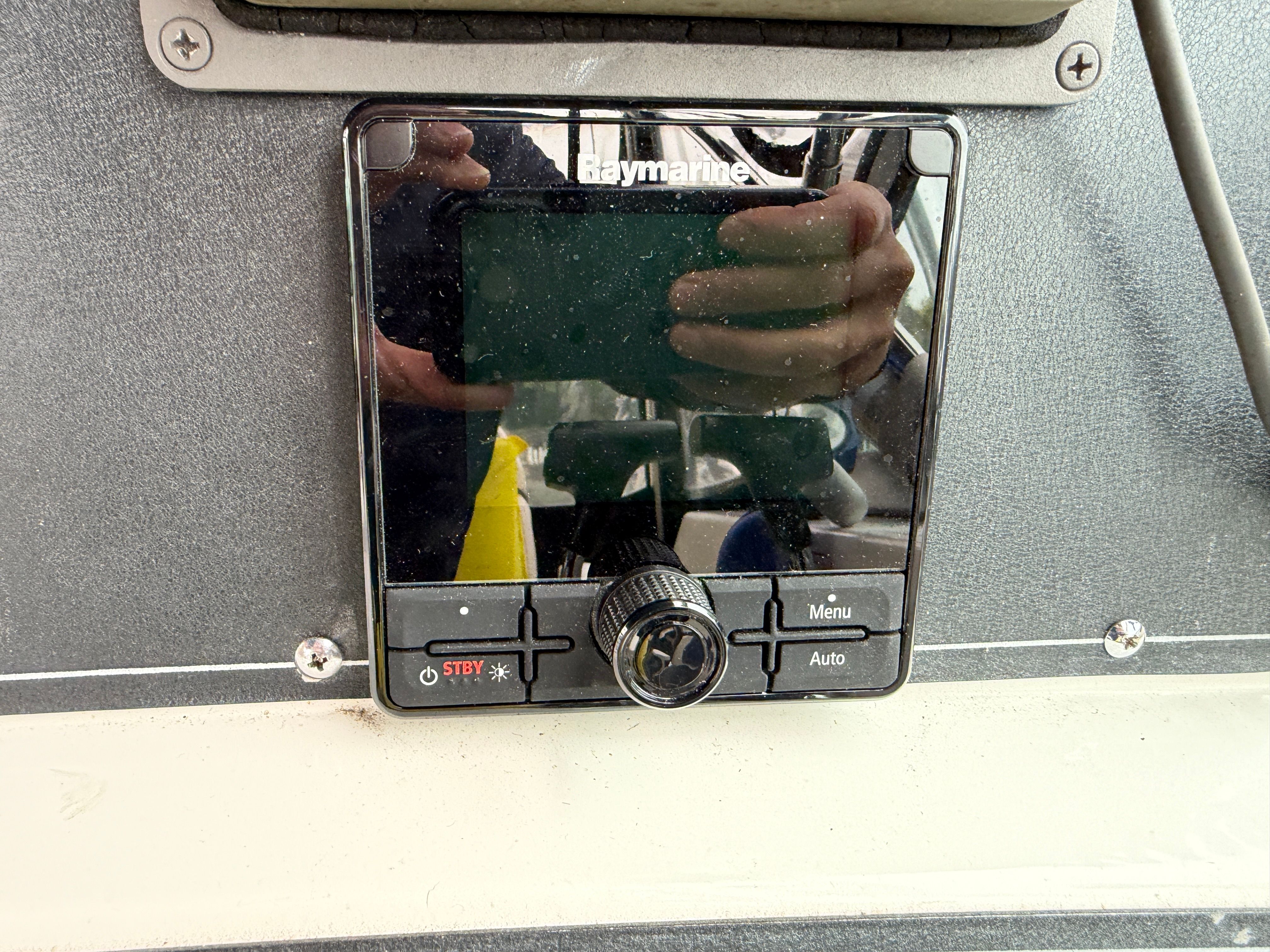 Close-up of a Raymarine control panel on a boat.