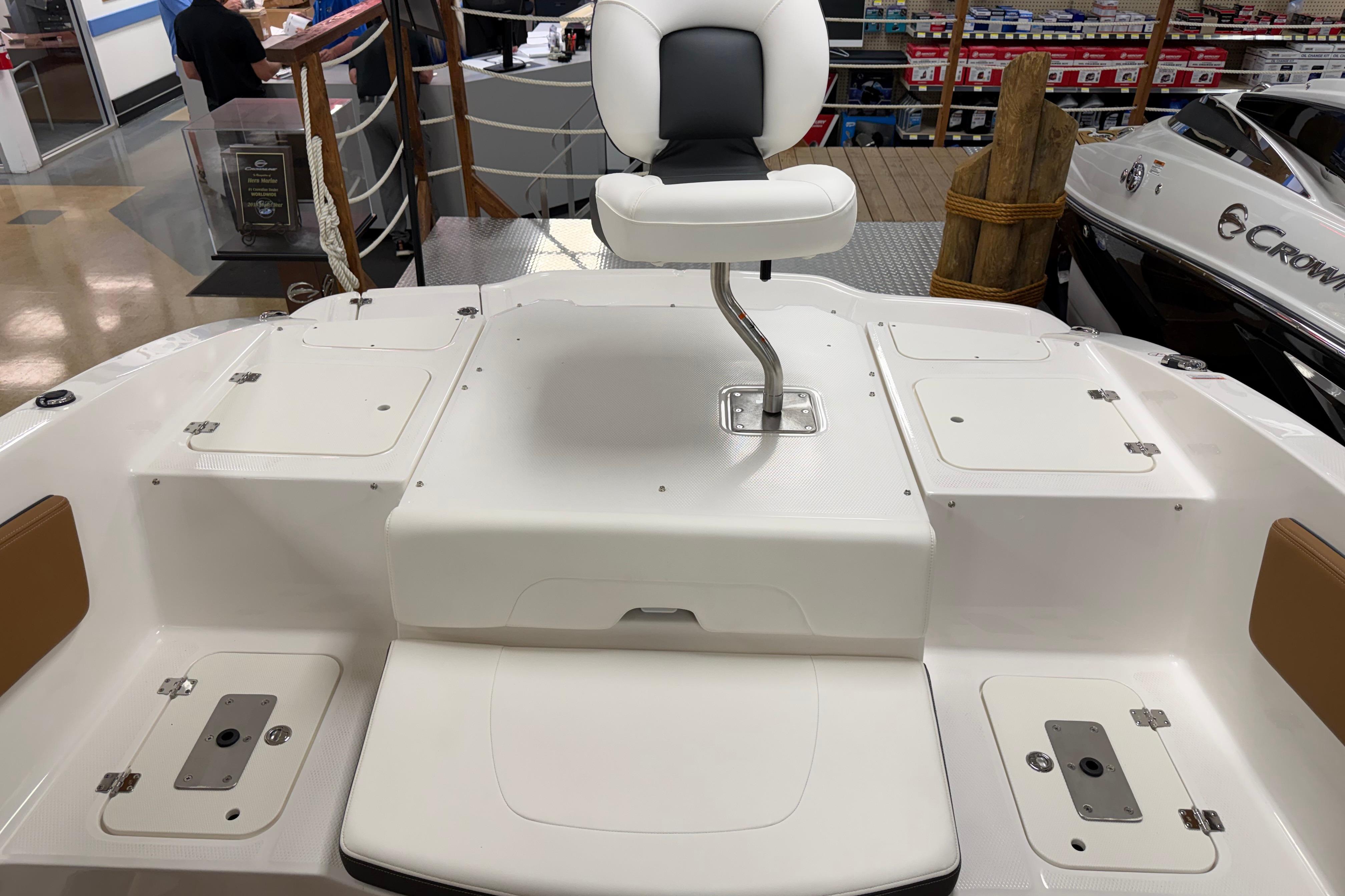 2026 Chaparral 21 SSi Ski & Fish boat interior with seating and storage compartments.