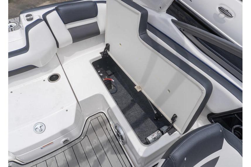 2021 Yamaha Boats 195S interior storage compartment with open hatch and seating.