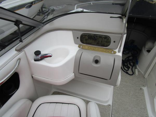 2004 Ebbtide 22 Mystique boat interior with seating and storage compartments.