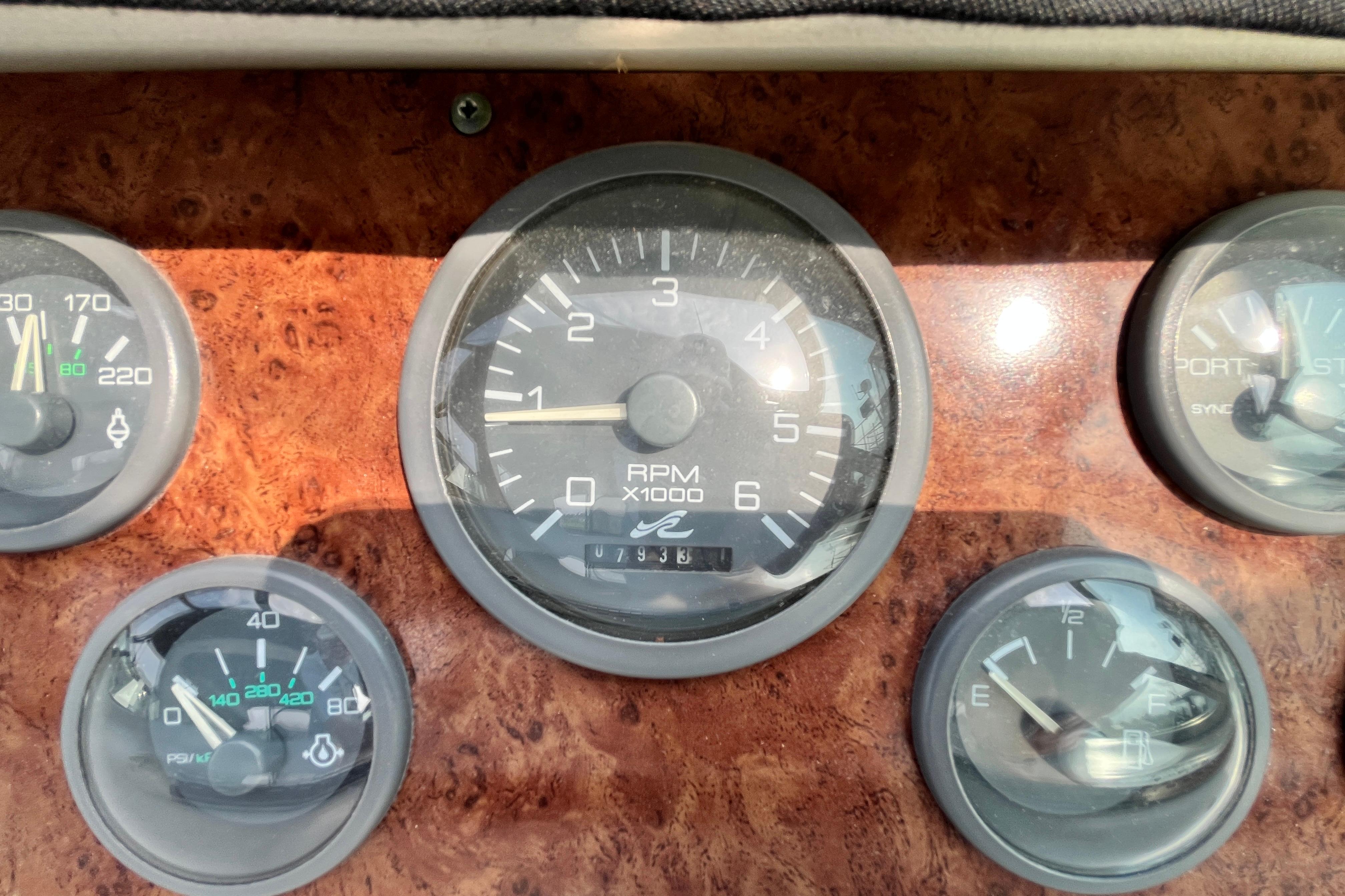 Dashboard gauges of a 1995 Sea Ray Sundancer 330 boat, featuring RPM and fuel indicators.