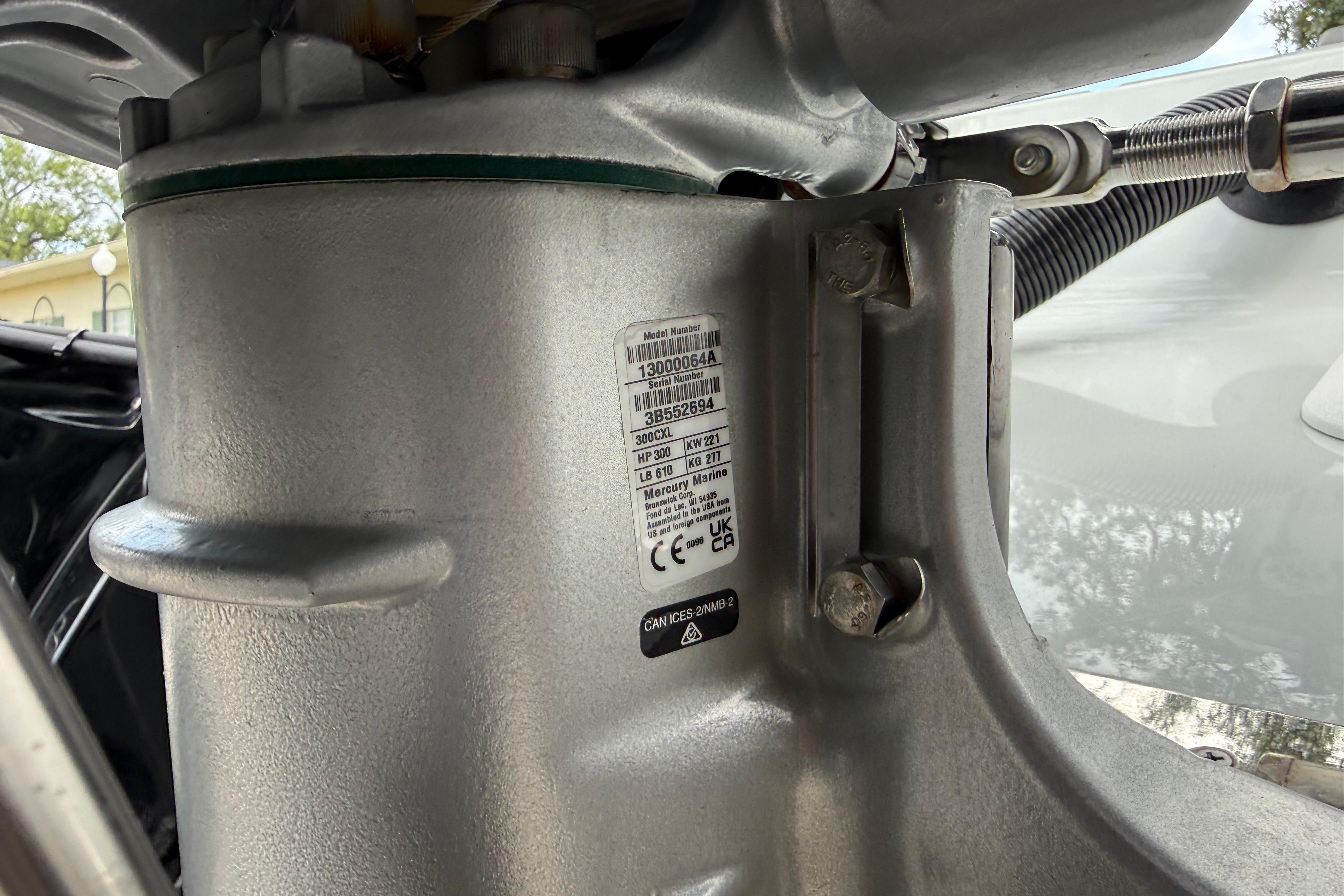 Close-up of a 2025 Caymas 281 HB boat engine component with label details.