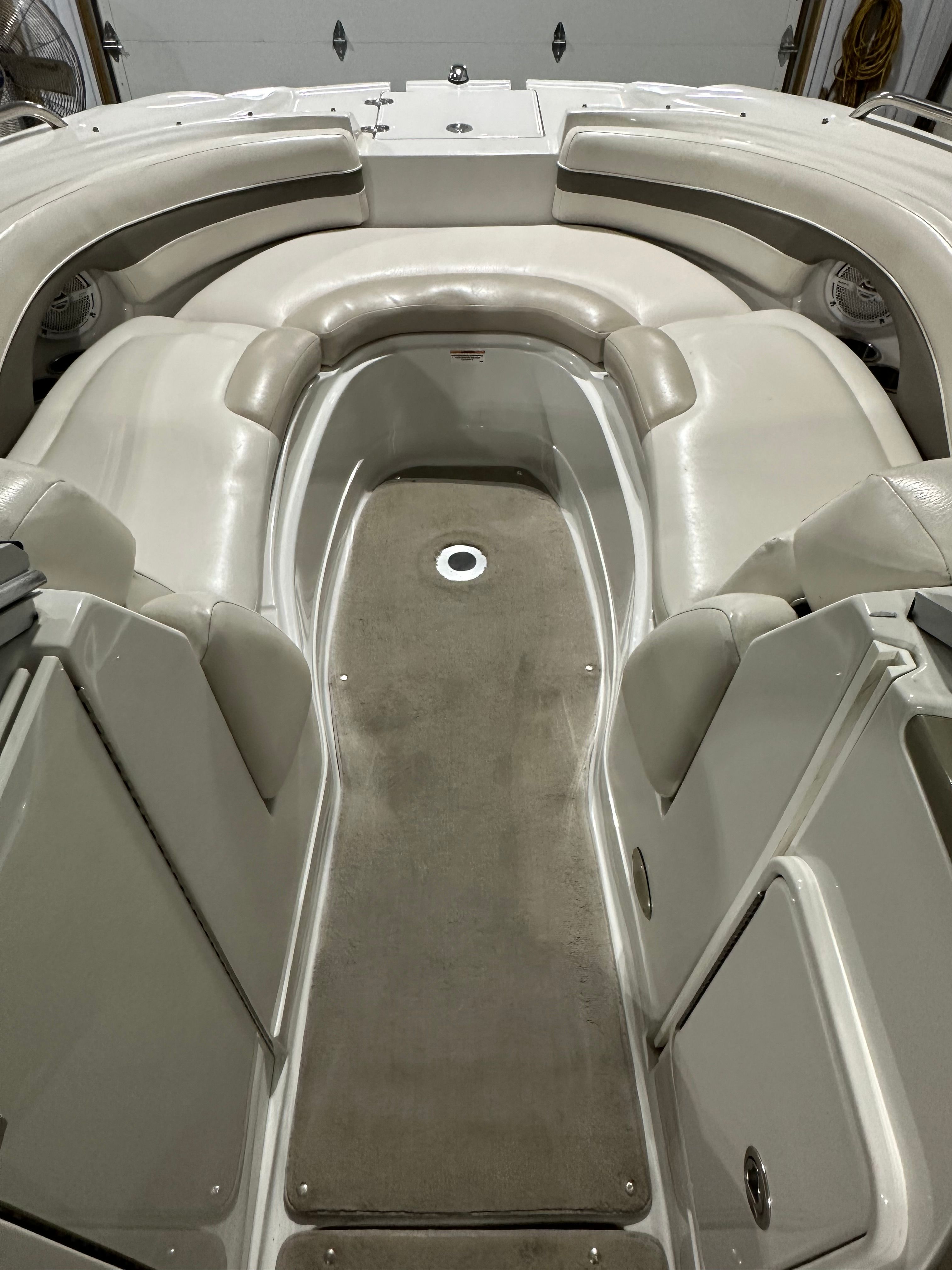 The image shows the cockpit of a 2007 Crownline 252 EX boat with beige upholstery.
