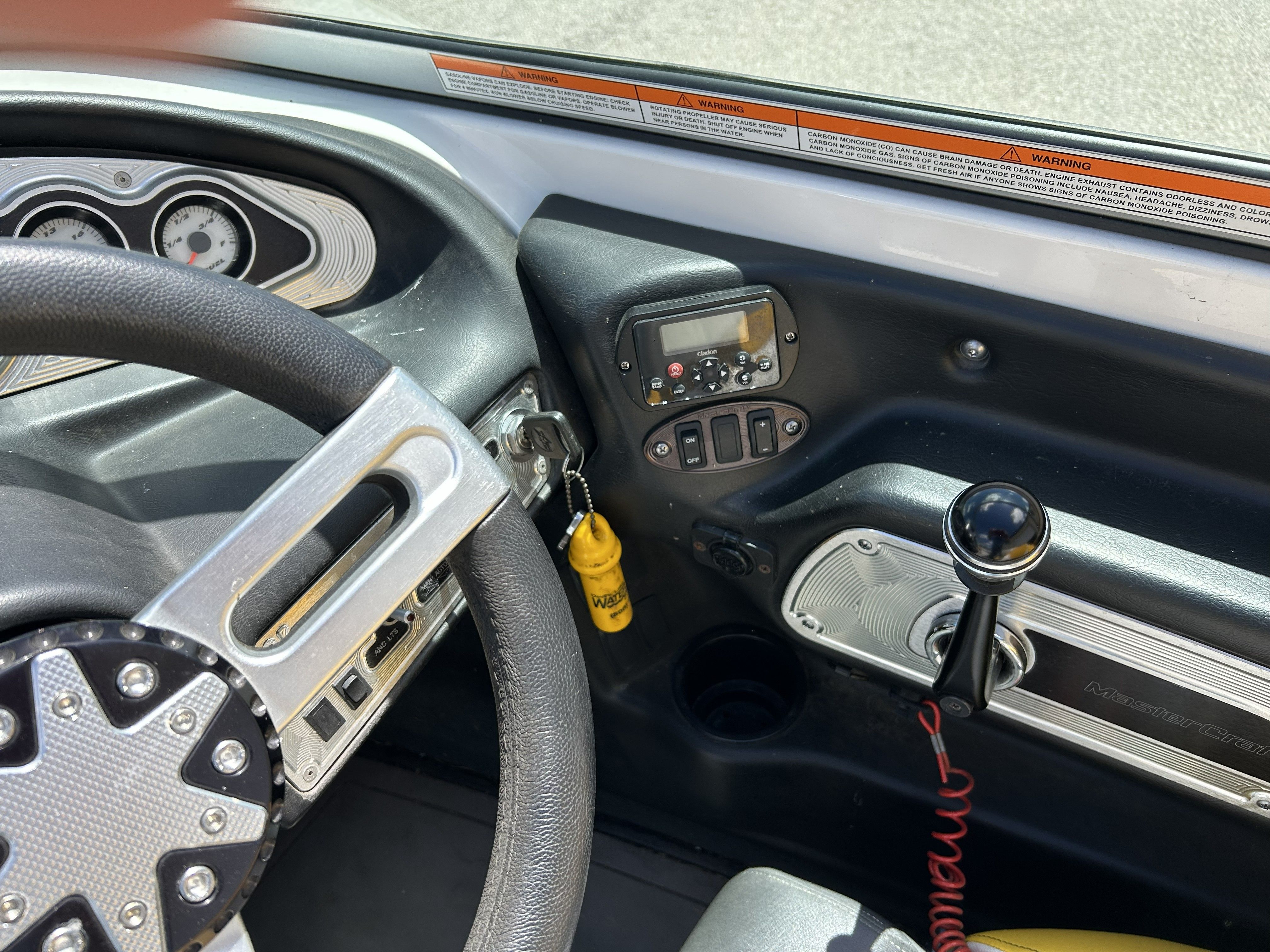 Interior of a 2011 MasterCraft PS197 boat with steering wheel and dashboard.