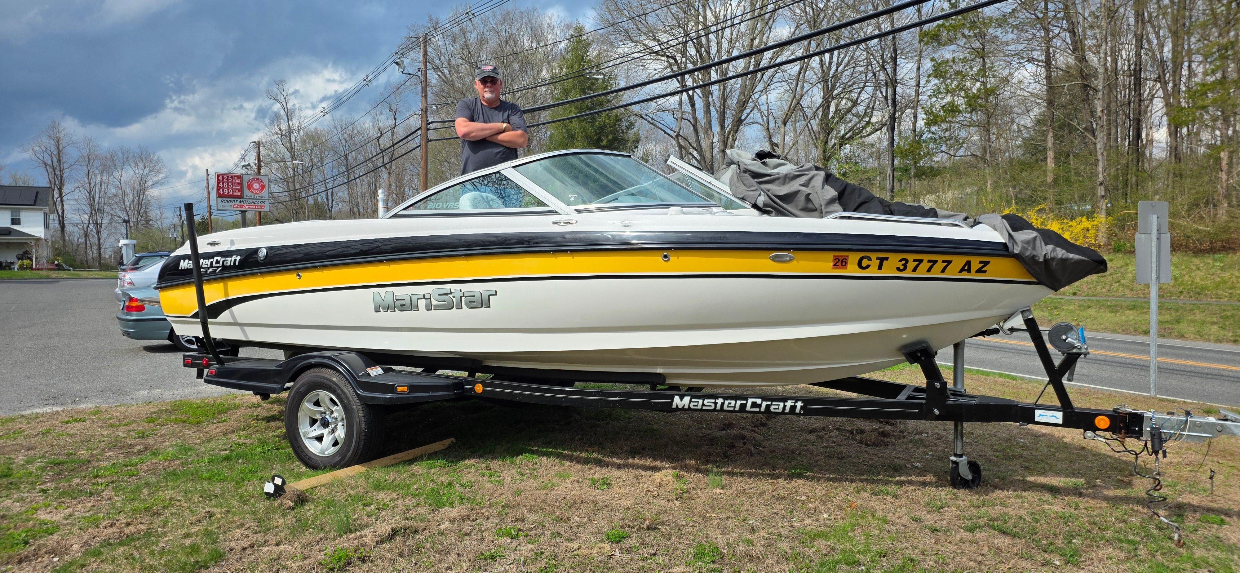 2004 MasterCraft Maristar boat on trailer with person in background.