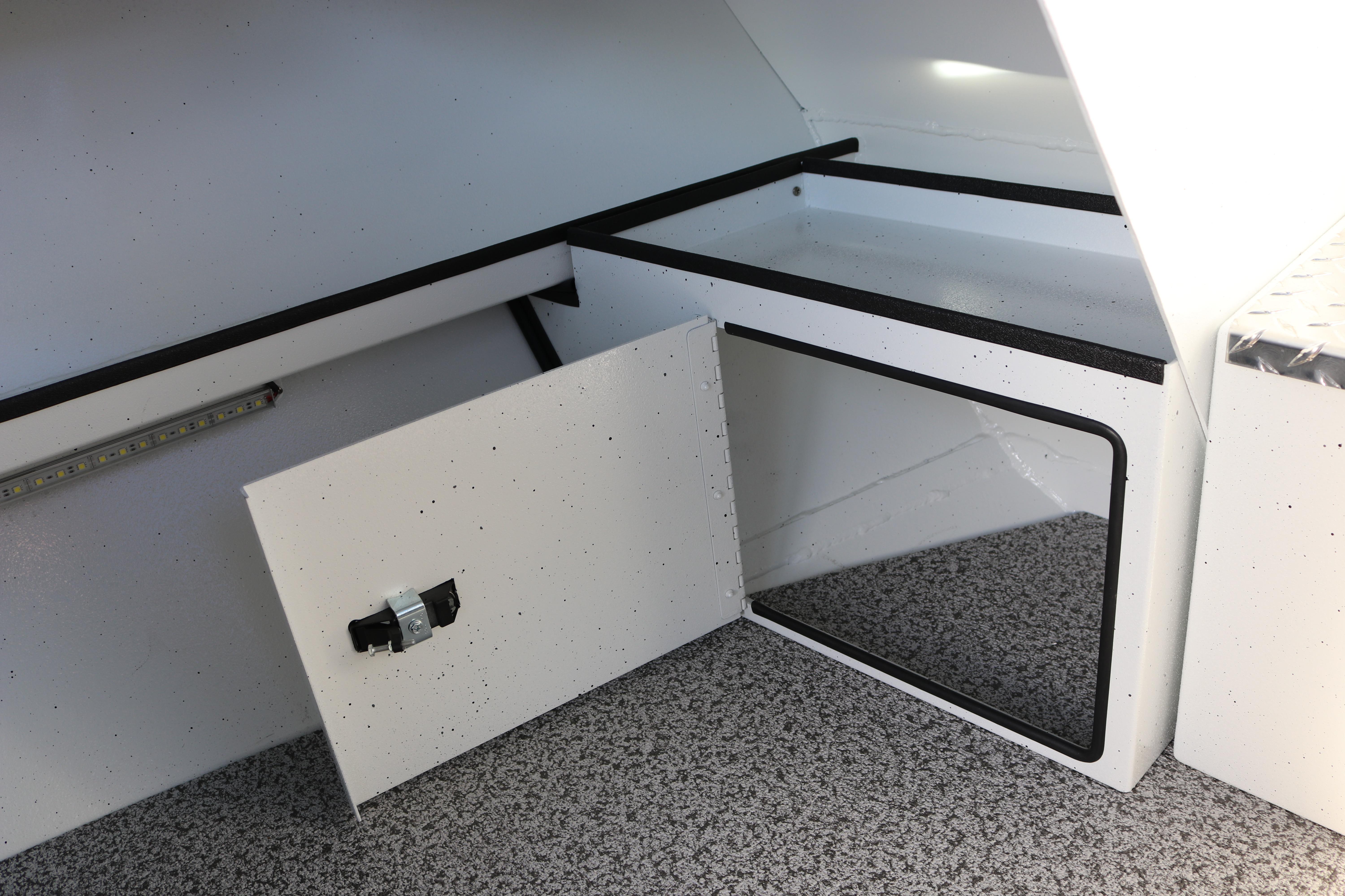 2026 Alumaweld Intruder Outboard 22 interior storage compartment with open hatch.