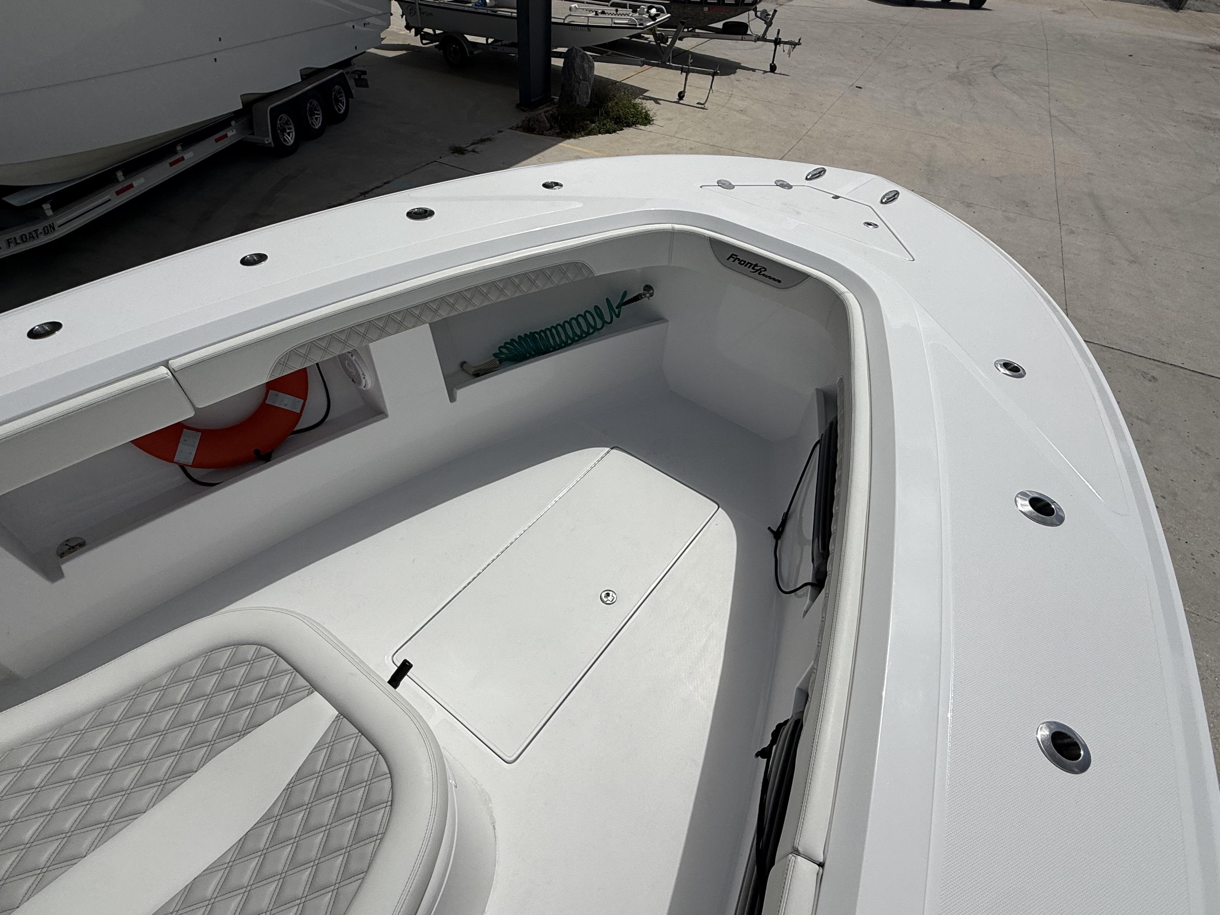 2024 Front Runner 39 CC boat interior with seating and storage compartments.