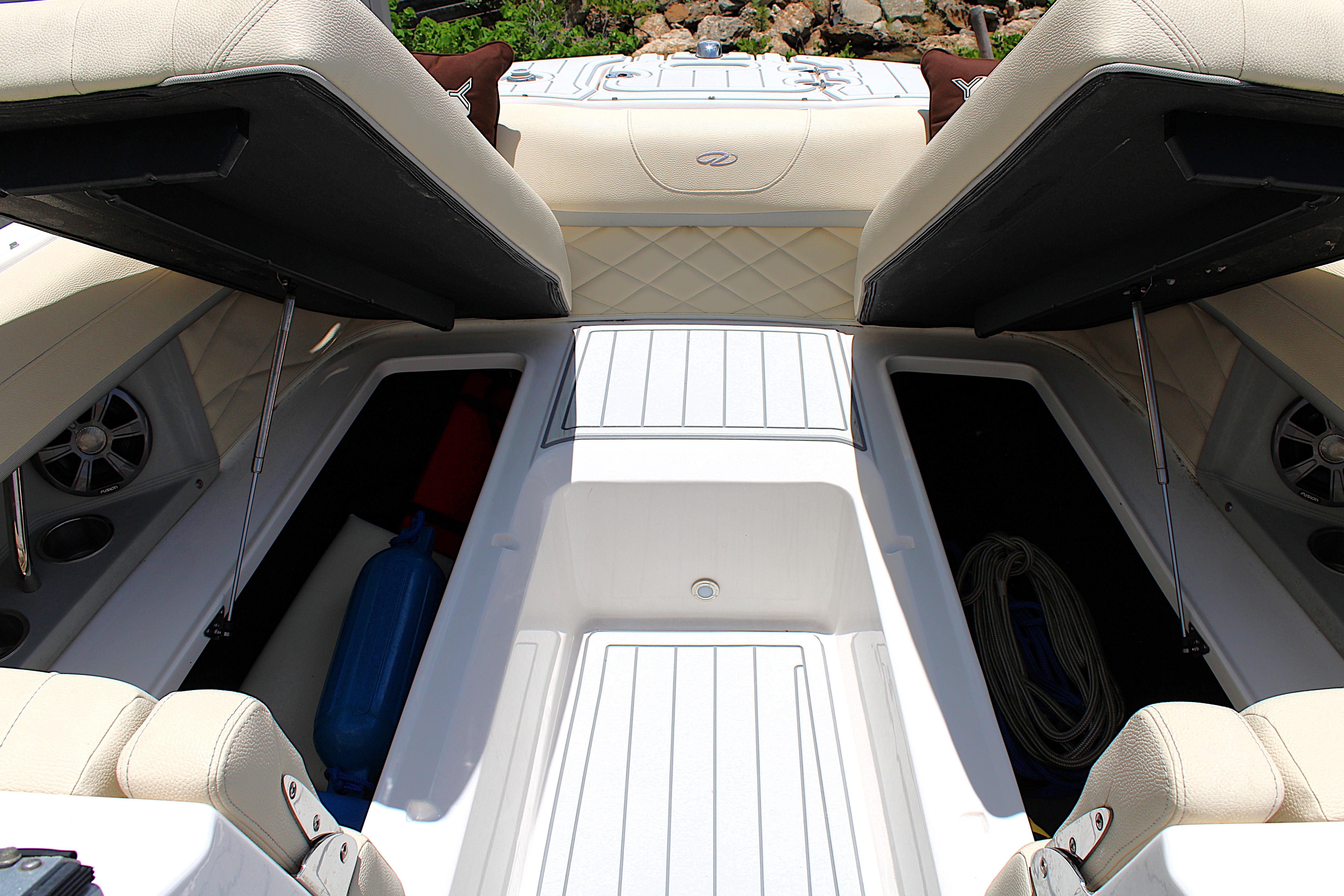 2021 Regal 26 OBX boat interior with open storage compartments and seating.