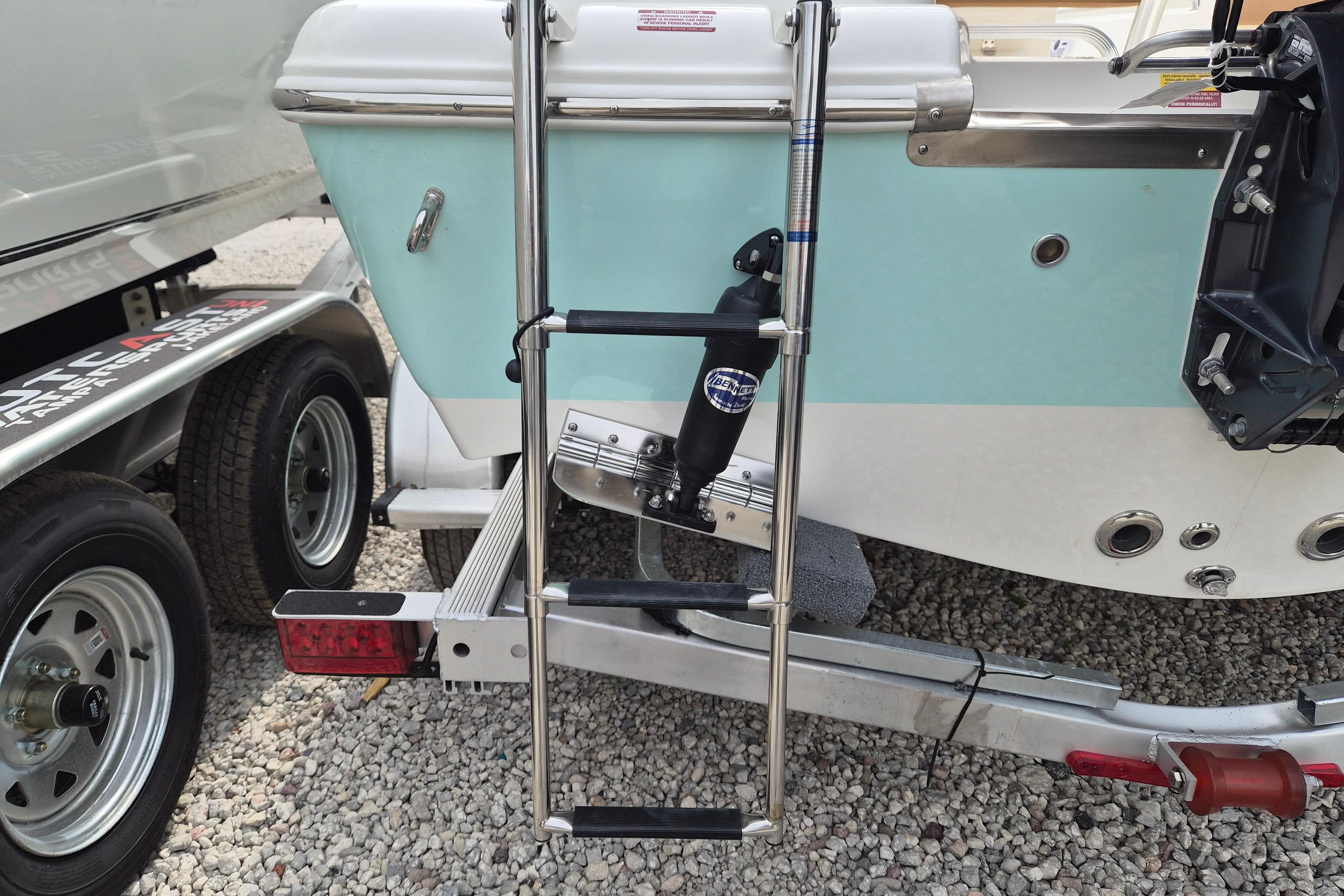 2026 Key West 189 FS boat on trailer with ladder and outboard motor mount.
