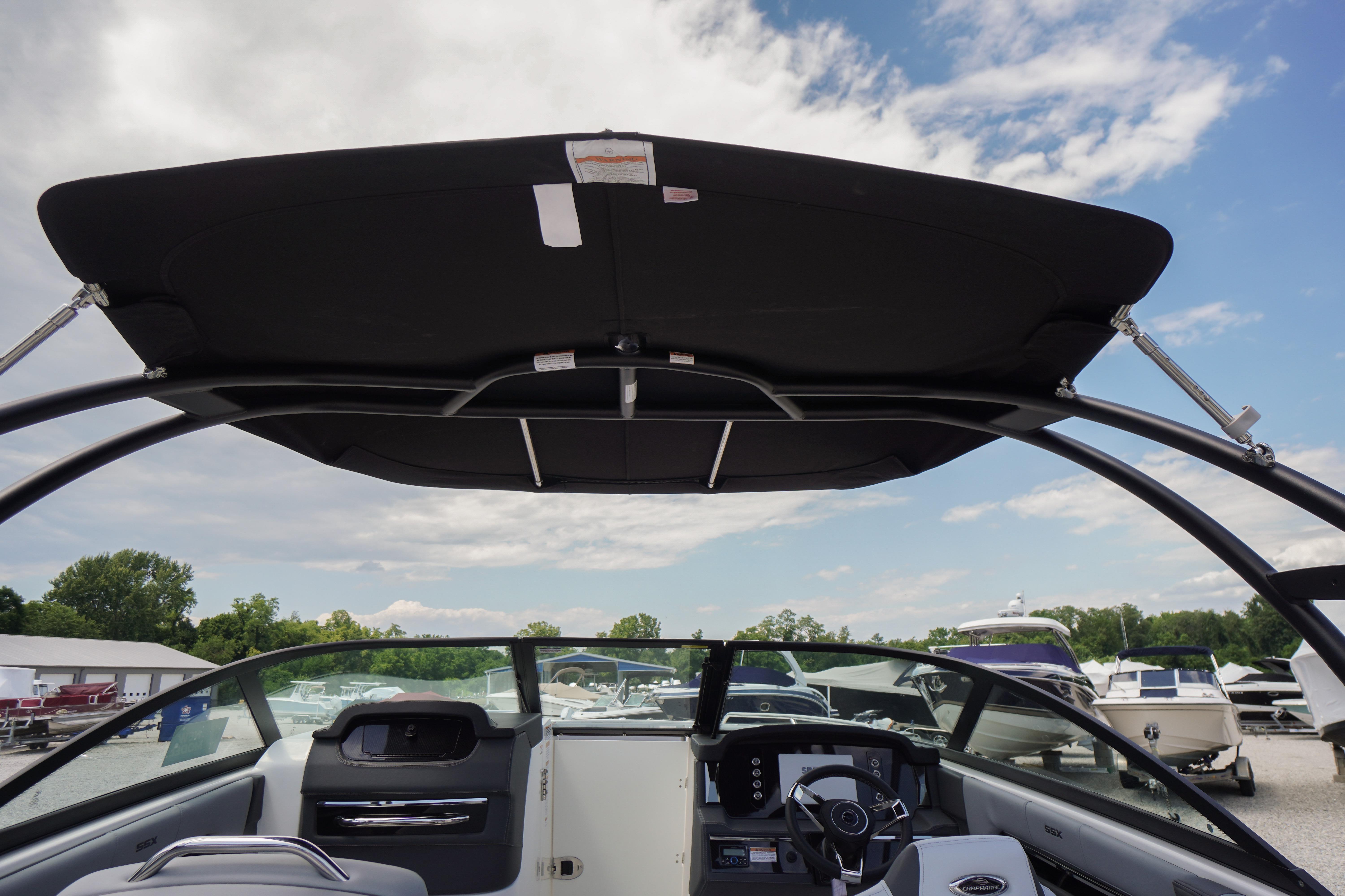 2026 Chaparral SSX 4 boat interior with canopy and steering console.