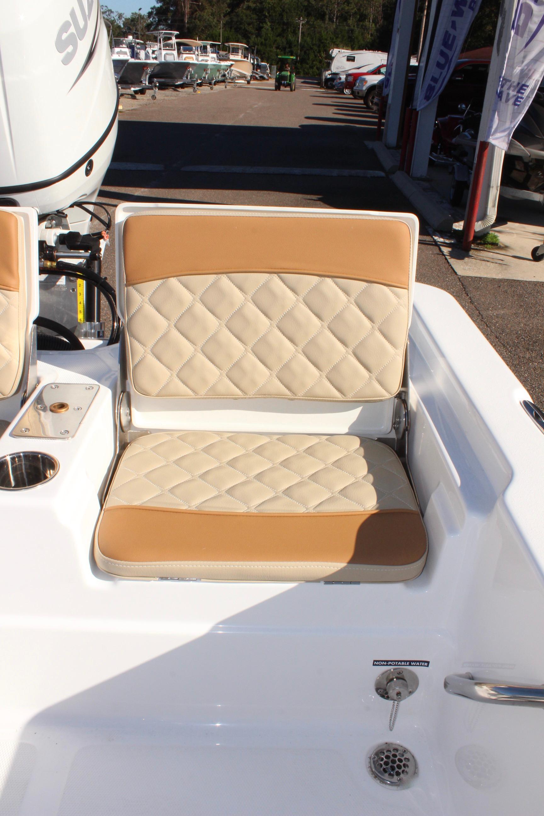 2025 NauticStar 214 Shallow Bay boat seat with tan and white diamond pattern upholstery.