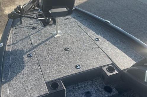 2026 Tracker Pro Team 195 boat deck with seating and storage compartments.