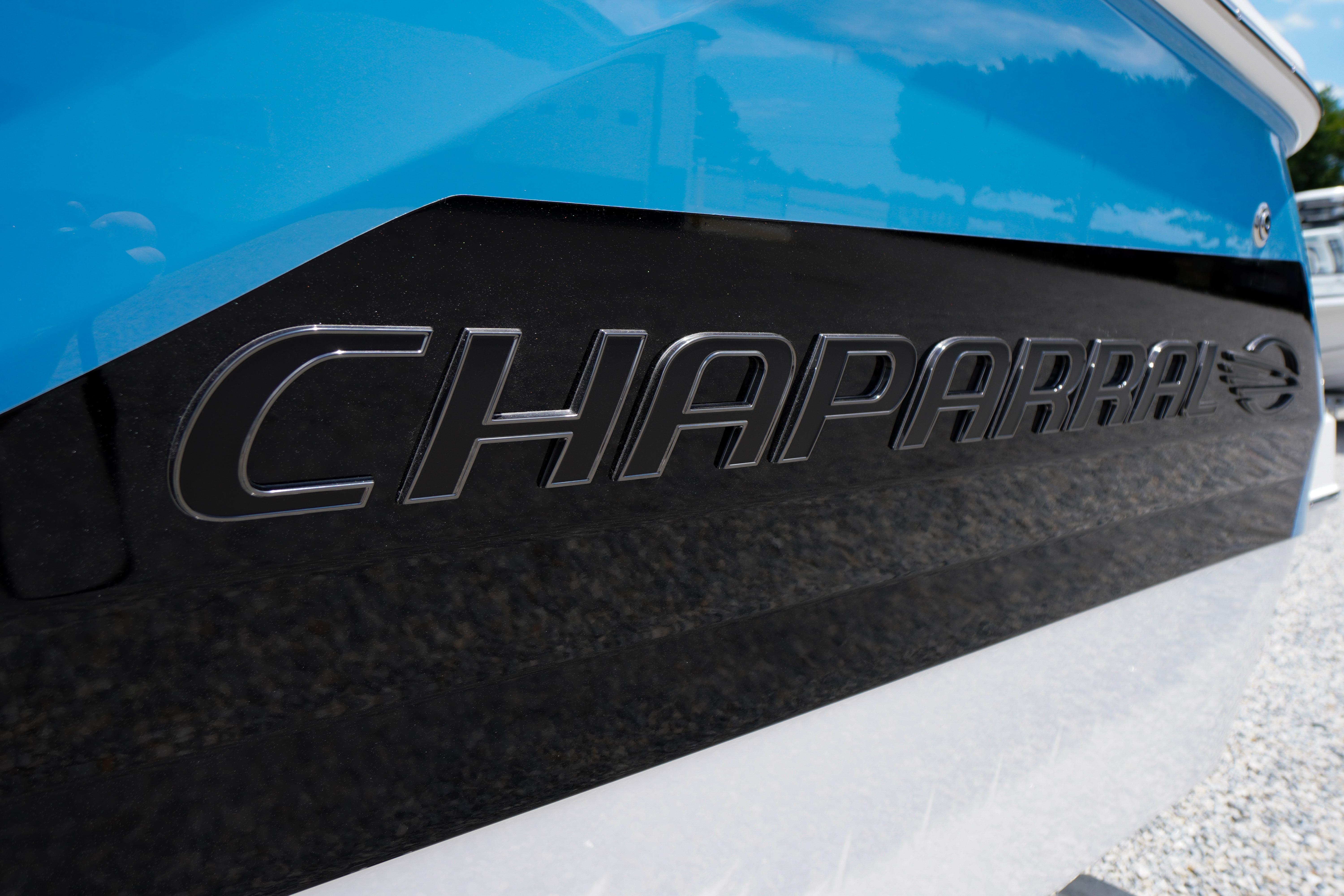 2026 Chaparral SSX 4 boat with sleek black and blue design.