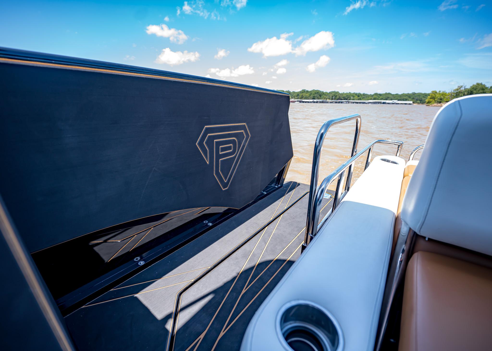 2025 Paradigm 236 boat interior with sleek design and lake view.