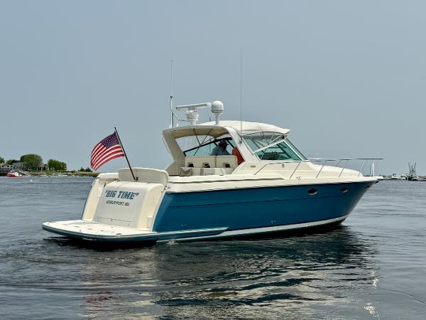 1996 Tiara Yachts 3500 Express on calm water with US flag.