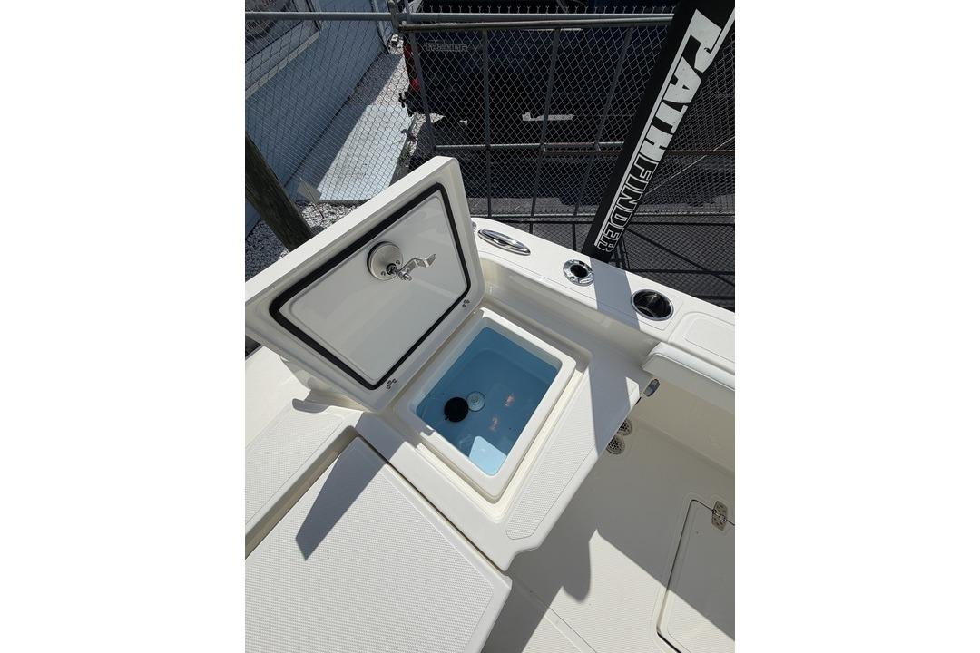 Open storage compartment on 2026 Pathfinder 2800 Hybrid boat deck.