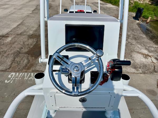 2022 Shallow Sport 20 Classic boat console with steering wheel and controls.