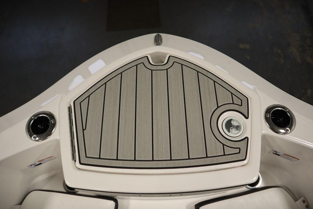 2026 Yamaha Boats 255 FSH Sport E bow with sleek deck design and cup holders.
